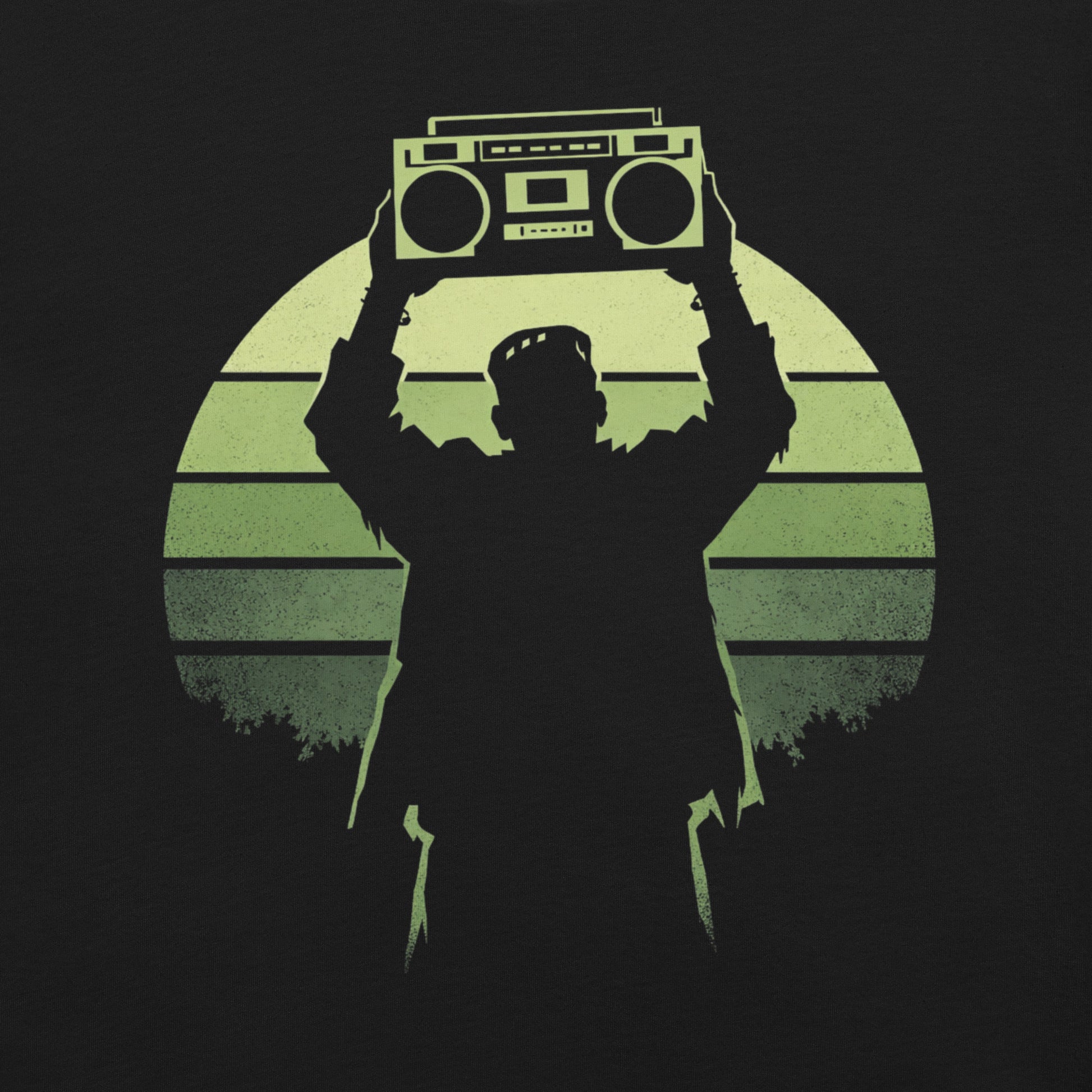 A retro-style graphic t-shirt featuring Frankenstein’s monster holding a 1980s boombox over his head in the iconic Say Anything movie pose, set against a vibrant neon sunburst.