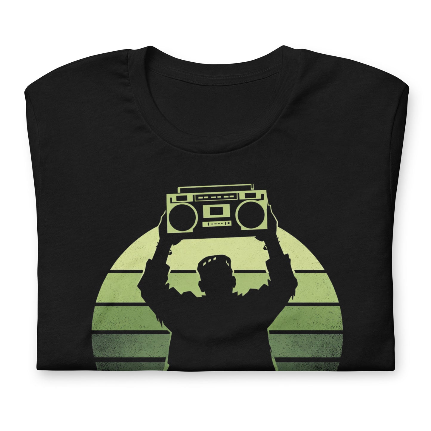 A retro-style graphic t-shirt featuring Frankenstein’s monster holding a 1980s boombox over his head in the iconic Say Anything movie pose, set against a vibrant neon sunburst.