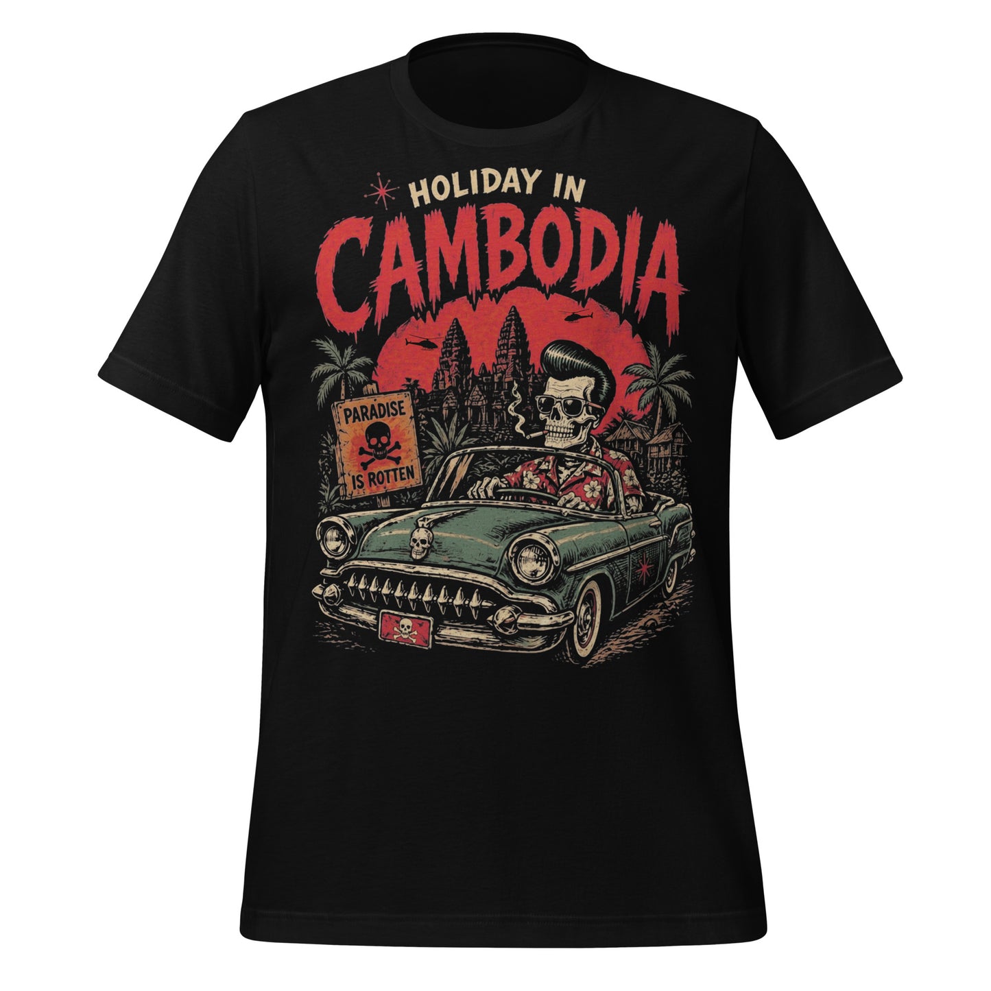 A detailed lowbrow graphic on a black t-shirt featuring a skeleton with a pompadour driving a 1955 Chevy convertible. The background shows Angkor Wat under a red sun with helicopters, and a sign that reads 'Paradise is Rotten'.