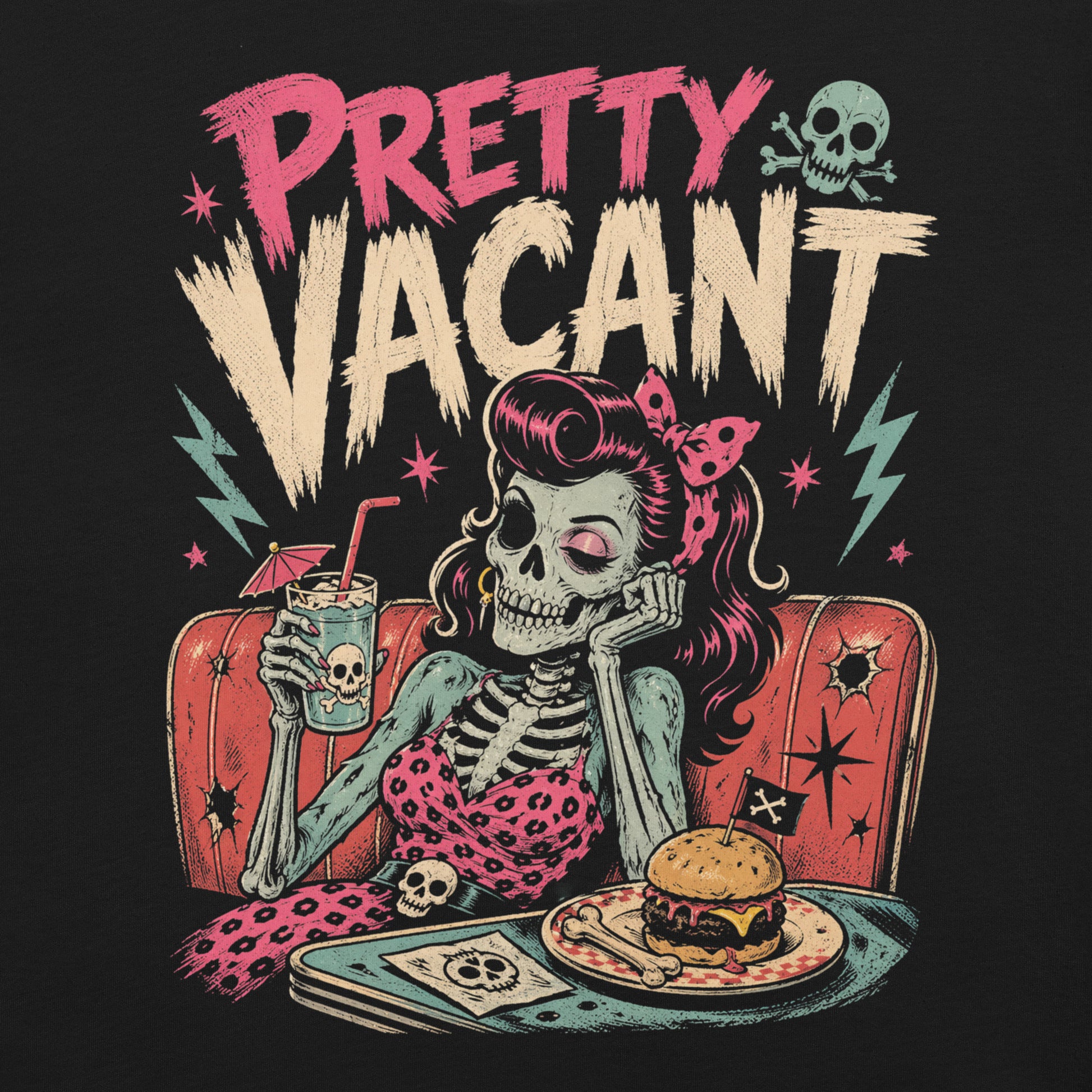 A retro-style graphic on a black t-shirt of a female skeleton pinup with pink hair in a diner booth, holding a skull-themed milkshake next to a burger with a crossbones flag.
