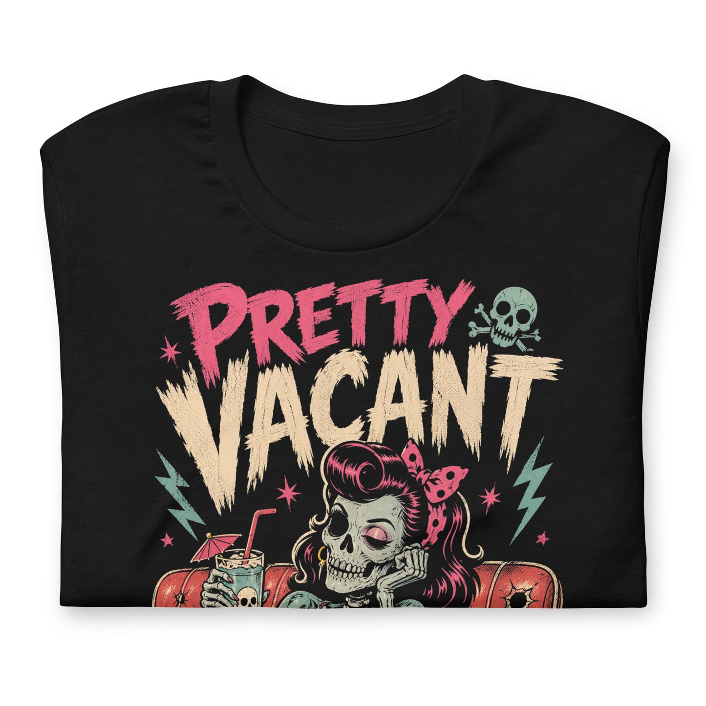 A retro-style graphic on a black t-shirt of a female skeleton pinup with pink hair in a diner booth, holding a skull-themed milkshake next to a burger with a crossbones flag.