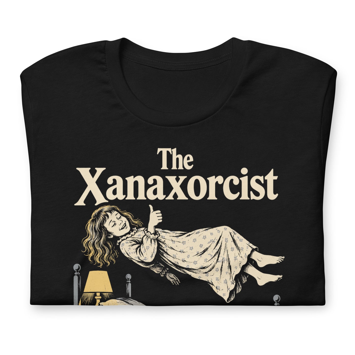 A retro horror-style graphic t-shirt featuring "The Xanaxorcist" in classic cinematic lettering with a stylized, eerie parody of the iconic exorcism scene.