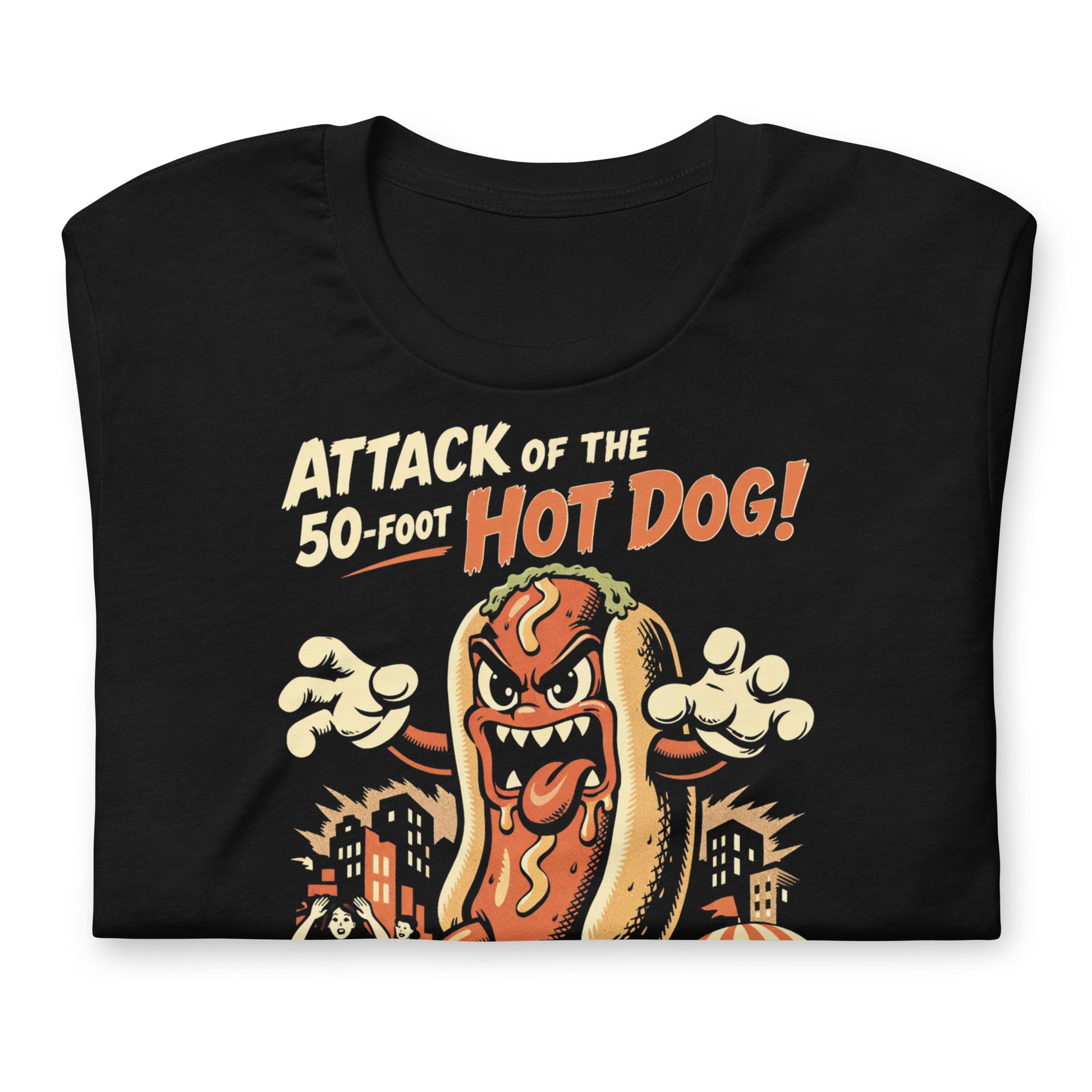A retro B-movie style graphic t-shirt featuring a giant 50-foot hot dog attacking a vintage city skyline, with campy horror-themed cinematic lettering.