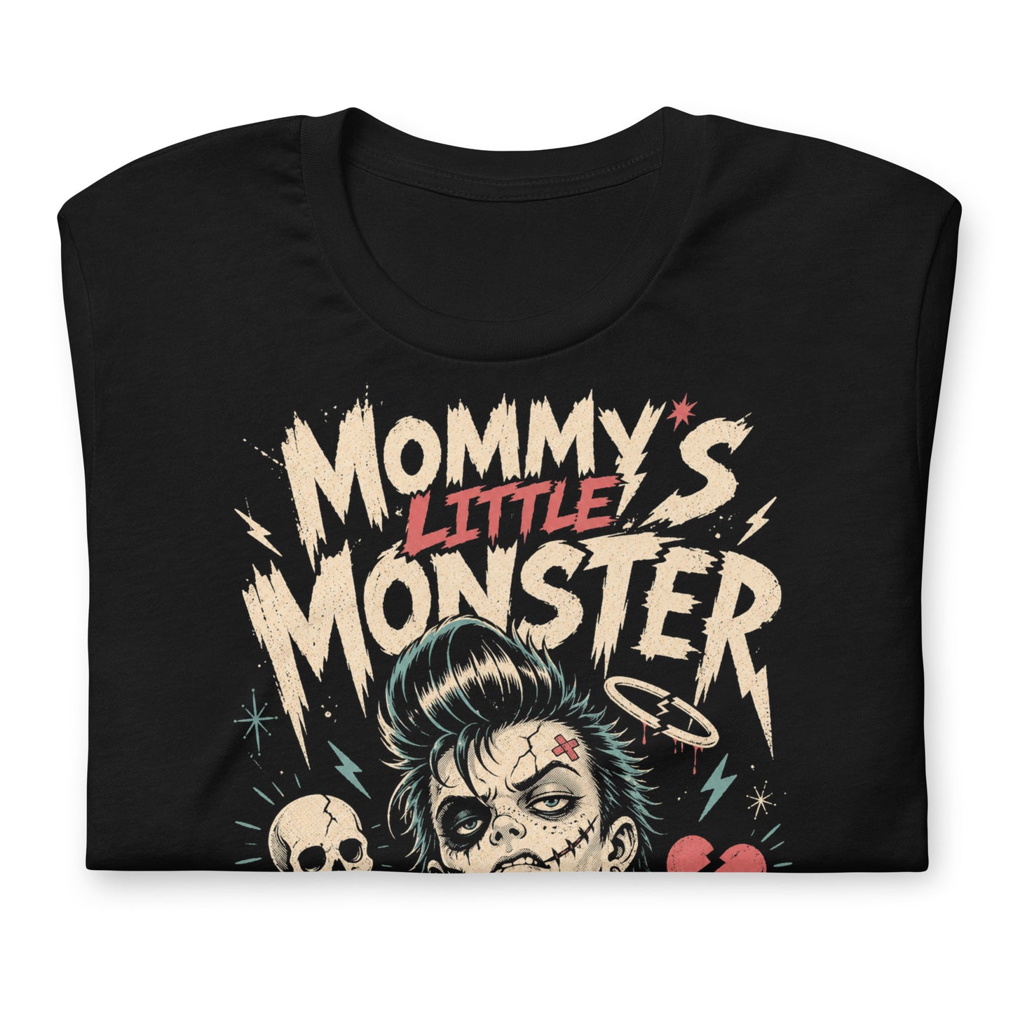 A retro lowbrow-style graphic on a black t-shirt featuring a green-skinned monster child with a black pompadour, stitched facial details, and leather jacket.