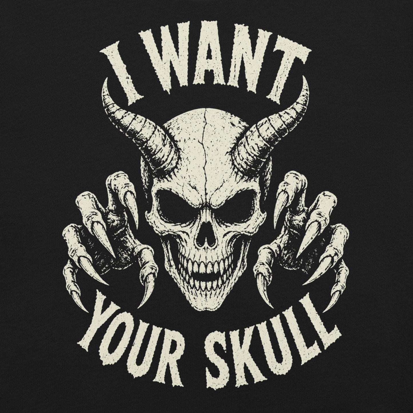 A retro-style graphic on a black t-shirt featuring a detailed horned demon skull with sharp claws and "I WANT YOUR SKULL" in distressed punk-rock lettering.