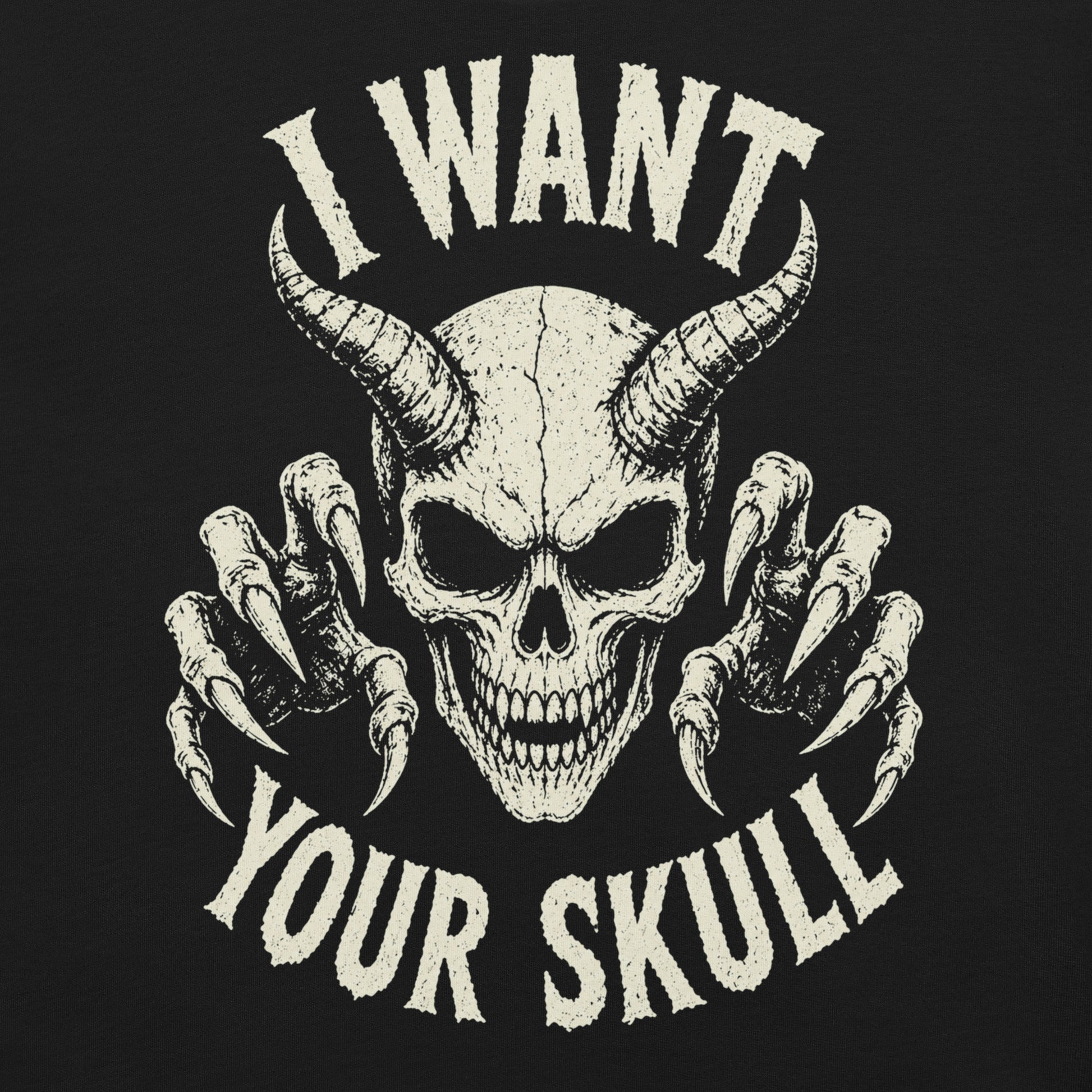 A retro-style graphic on a black t-shirt featuring a detailed horned demon skull with sharp claws and "I WANT YOUR SKULL" in distressed punk-rock lettering.