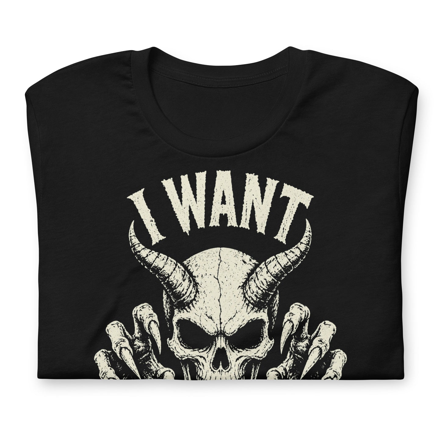 A retro-style graphic on a black t-shirt featuring a detailed horned demon skull with sharp claws and "I WANT YOUR SKULL" in distressed punk-rock lettering.