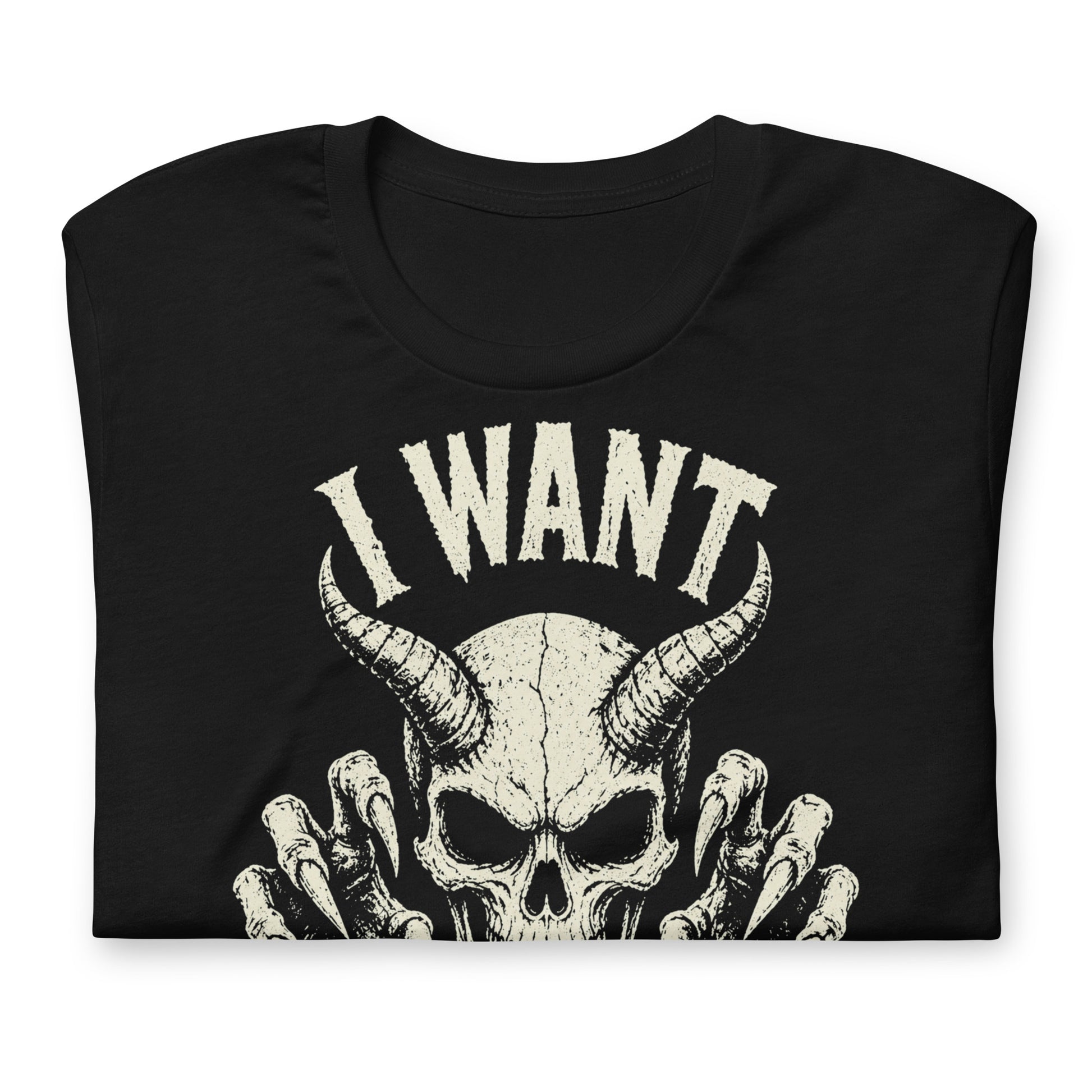 A retro-style graphic on a black t-shirt featuring a detailed horned demon skull with sharp claws and "I WANT YOUR SKULL" in distressed punk-rock lettering.