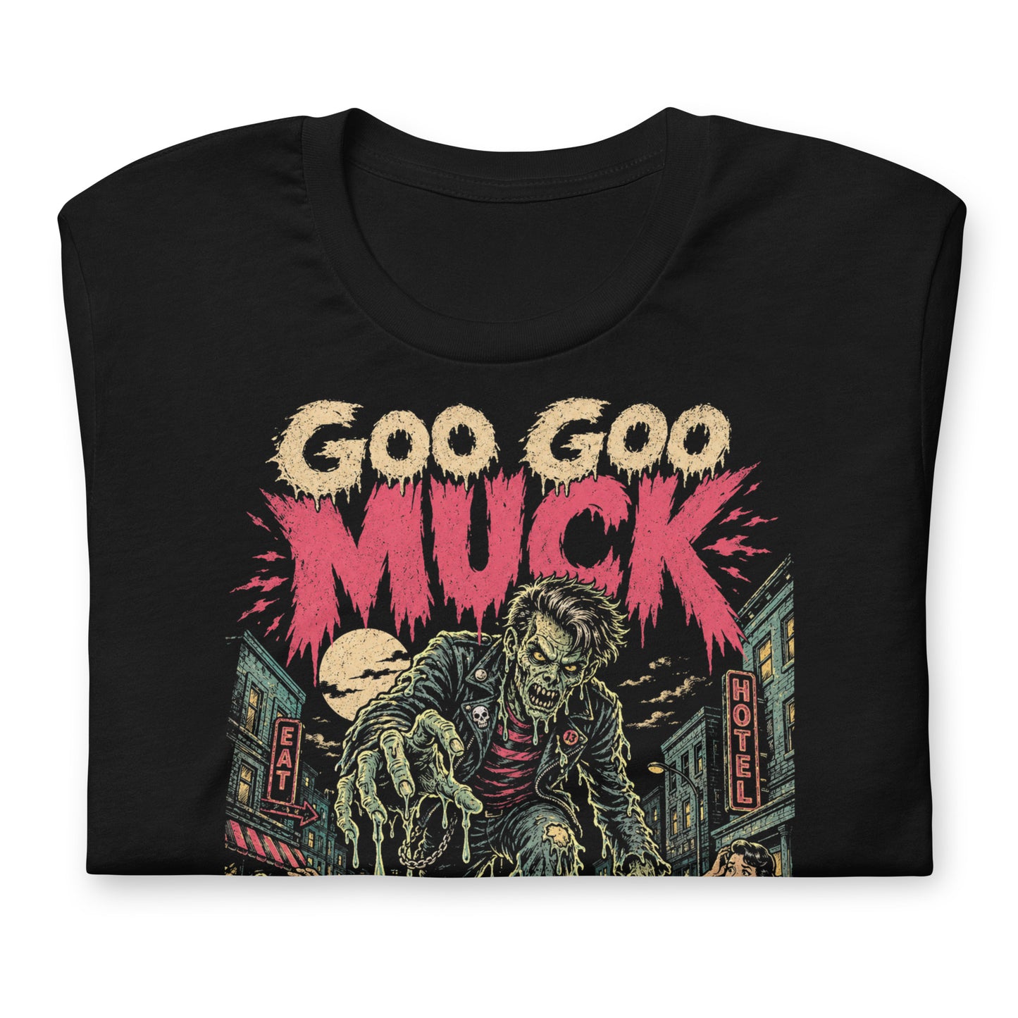A retro-style graphic on a black t-shirt featuring a teenage monster with a pompadour, wearing a red and black striped shirt and a black leather jacket, with "GOO GOO MUCK" in distressed lettering.