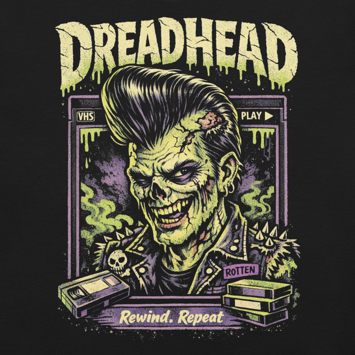 A retro 80s horror-style graphic on a black t-shirt featuring a zombie greaser with a pompadour and "Dreadhead" and "Rewind Repeat" in distressed VHS-style lettering.