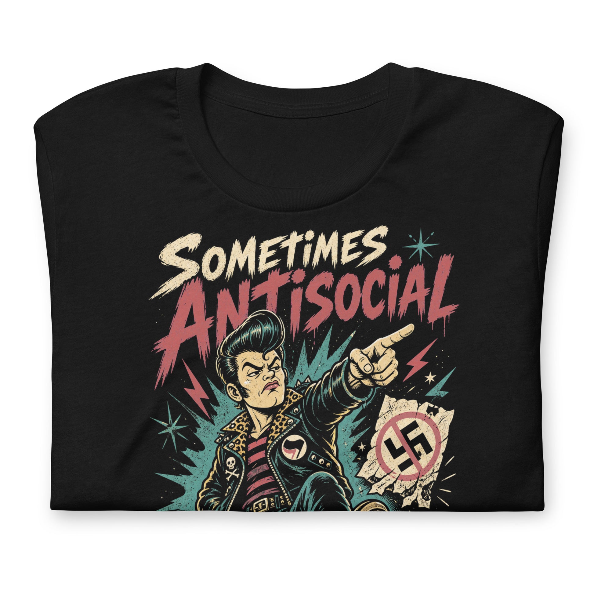 A gritty, lowbrow illustration on a black t-shirt of a pompadoured greaser in a leopard-print lined leather jacket, kicking over hate symbols. Text reads 'Sometimes Antisocial Always Antifascist' in a distressed punk-style font.
