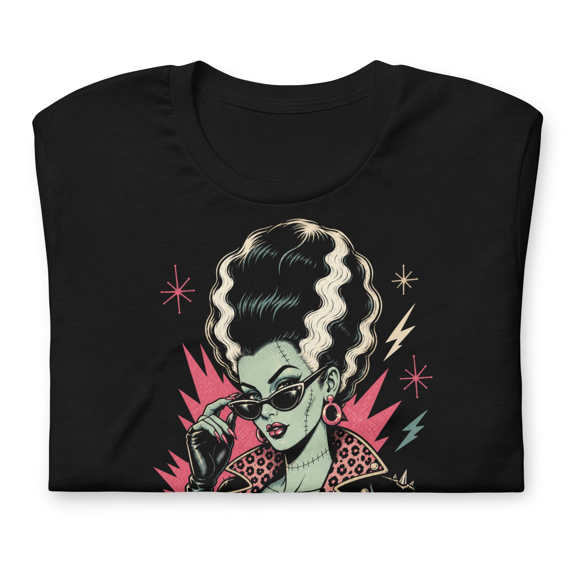 Artistic illustration of a green-skinned monster bride with high-volume black and white hair, cat-eye sunglasses, and a leopard-print lined leather jacket on a black t-shirt.