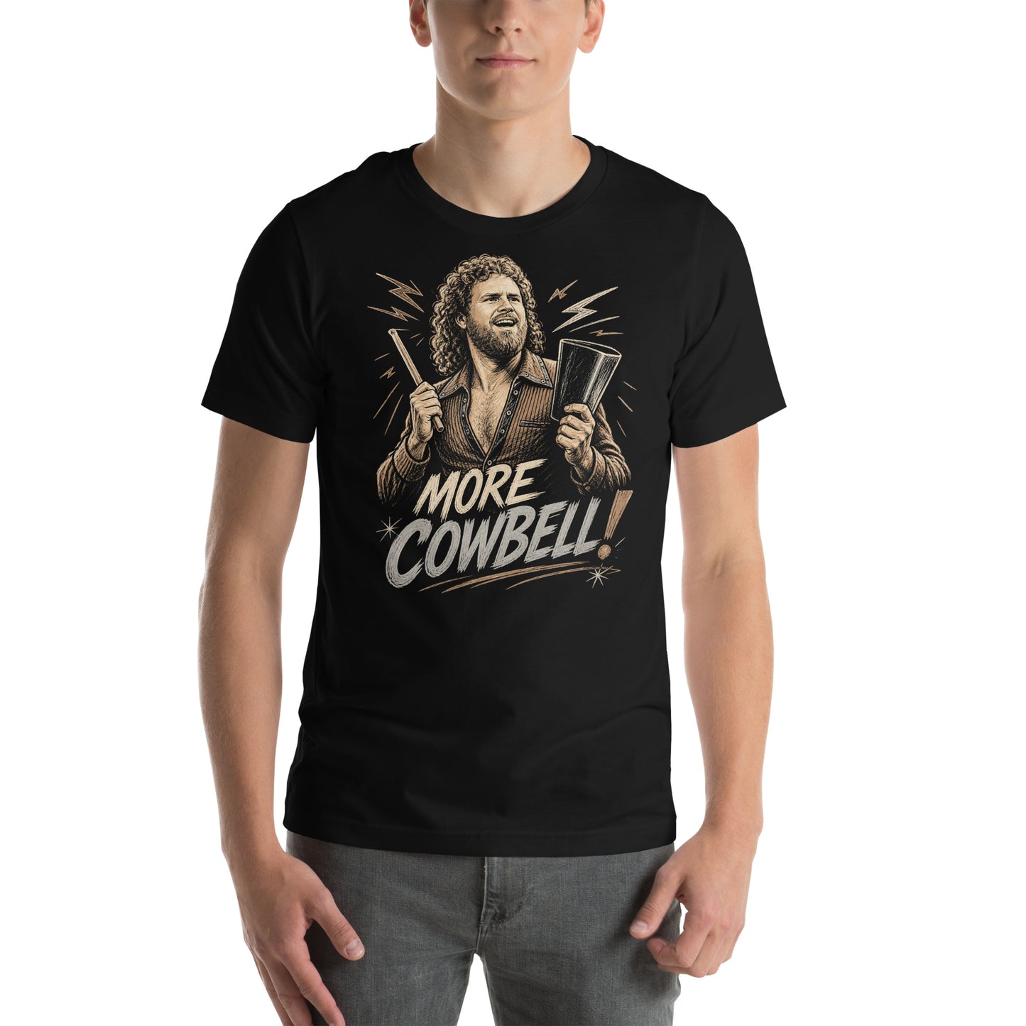 A gritty, woodcut-style illustration on a black t-shirt featuring a bearded man with curly hair and an open-collared 70s shirt holding a cowbell and drumstick, with the text 'MORE COWBELL!' in a distressed font.