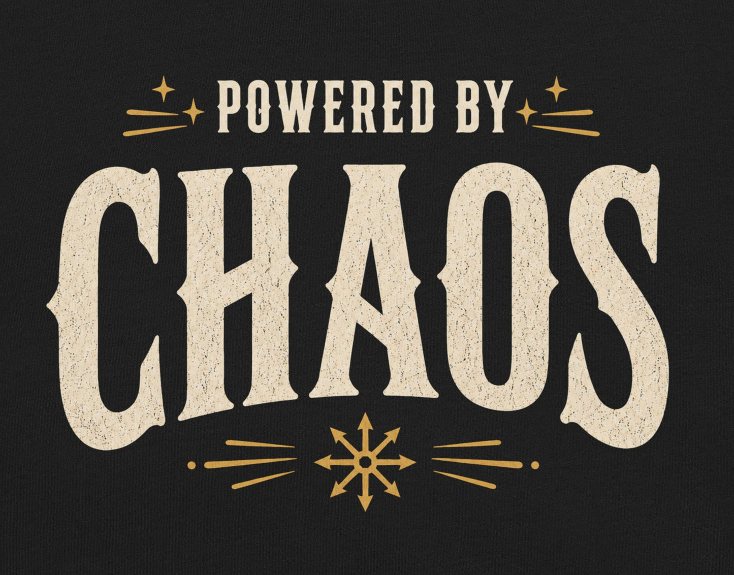 Powered by Chaos t-shirt on black Bella Canvas tee with vintage cream typography and occult symbol accents