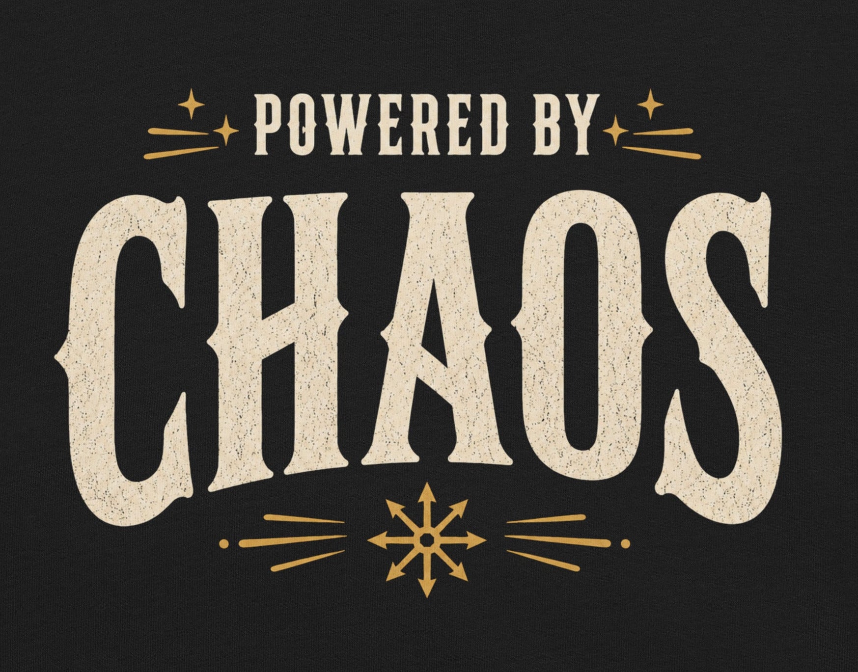 Powered by Chaos t-shirt on black Bella Canvas tee with vintage cream typography and occult symbol accents
