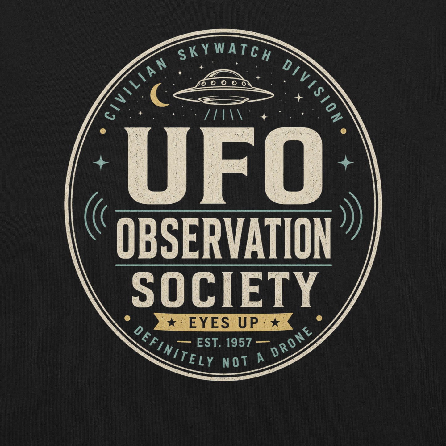Close-up of UFO Observation Society t-shirt design with flying saucer, night sky details, and retro observation club typography