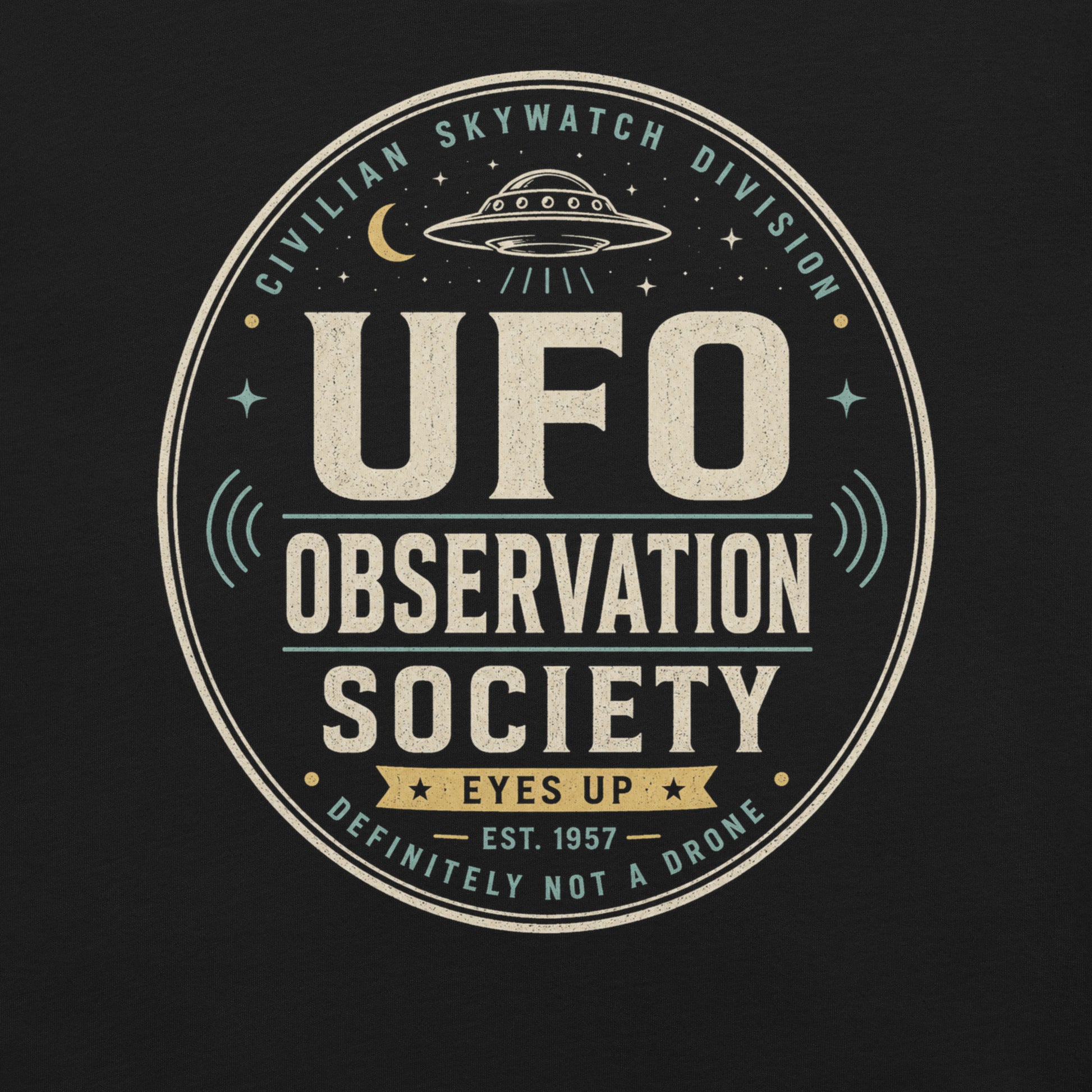Close-up of UFO Observation Society t-shirt design with flying saucer, night sky details, and retro observation club typography