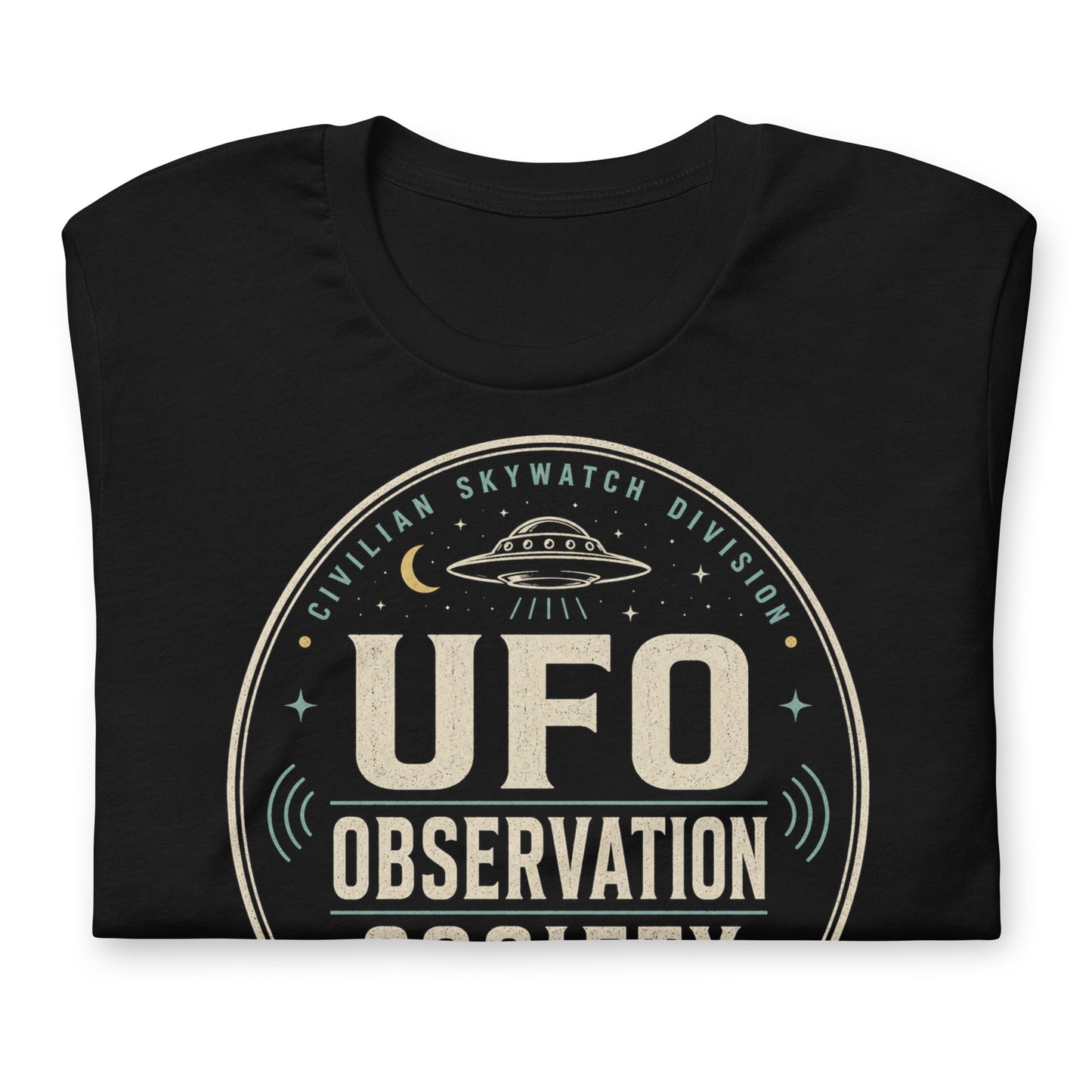 Close-up of UFO Observation Society t-shirt design with flying saucer, night sky details, and retro observation club typography