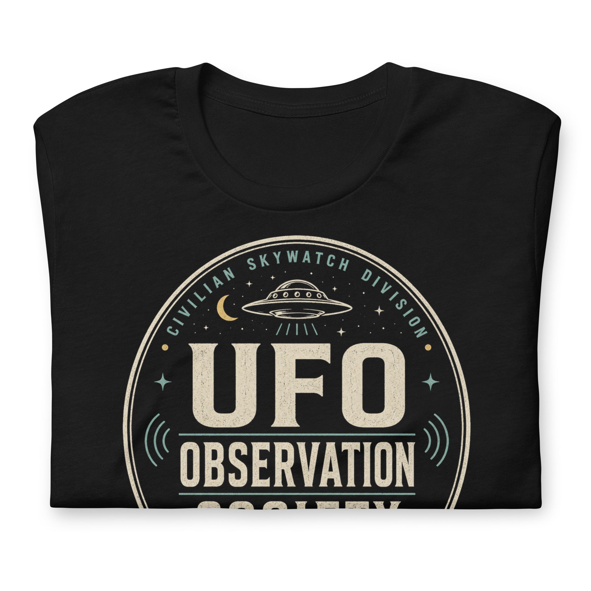 Close-up of UFO Observation Society t-shirt design with flying saucer, night sky details, and retro observation club typography