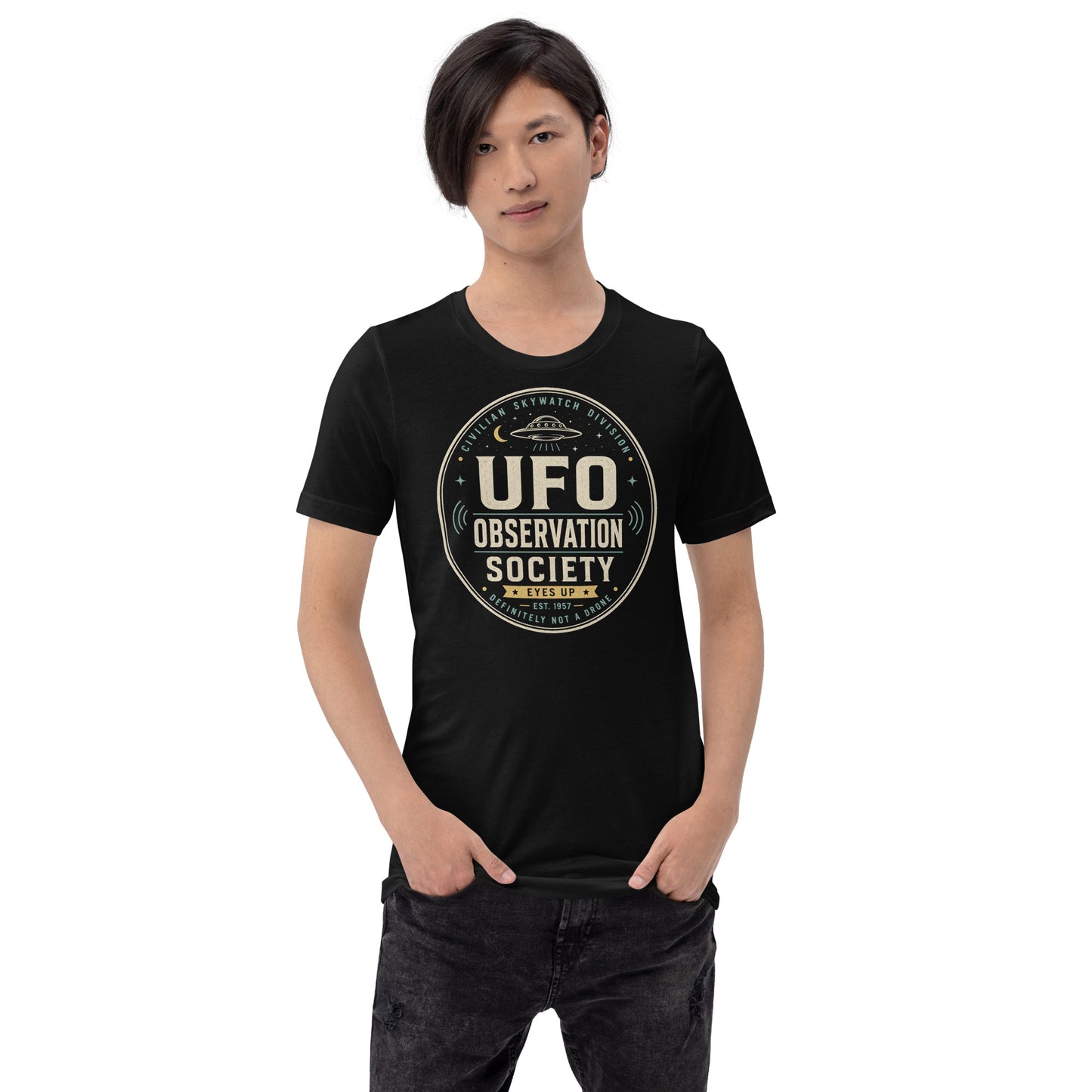Male lifestyle mockup wearing black UFO Observation Society t-shirt with retro alien skywatch graphic by Cinderpoint Studios