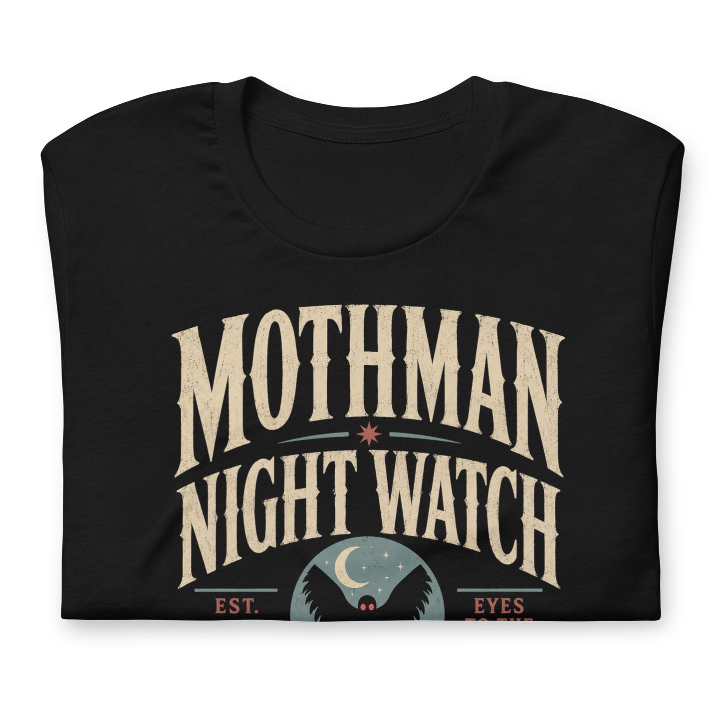 Close-up of the Mothman Night Watch original Cinderpoint Studios artwork printed on a black tee, showing distressed retro lettering, Mothman silhouette with red eyes, crescent moon, bridge scene, and Winged Incident Unit text.