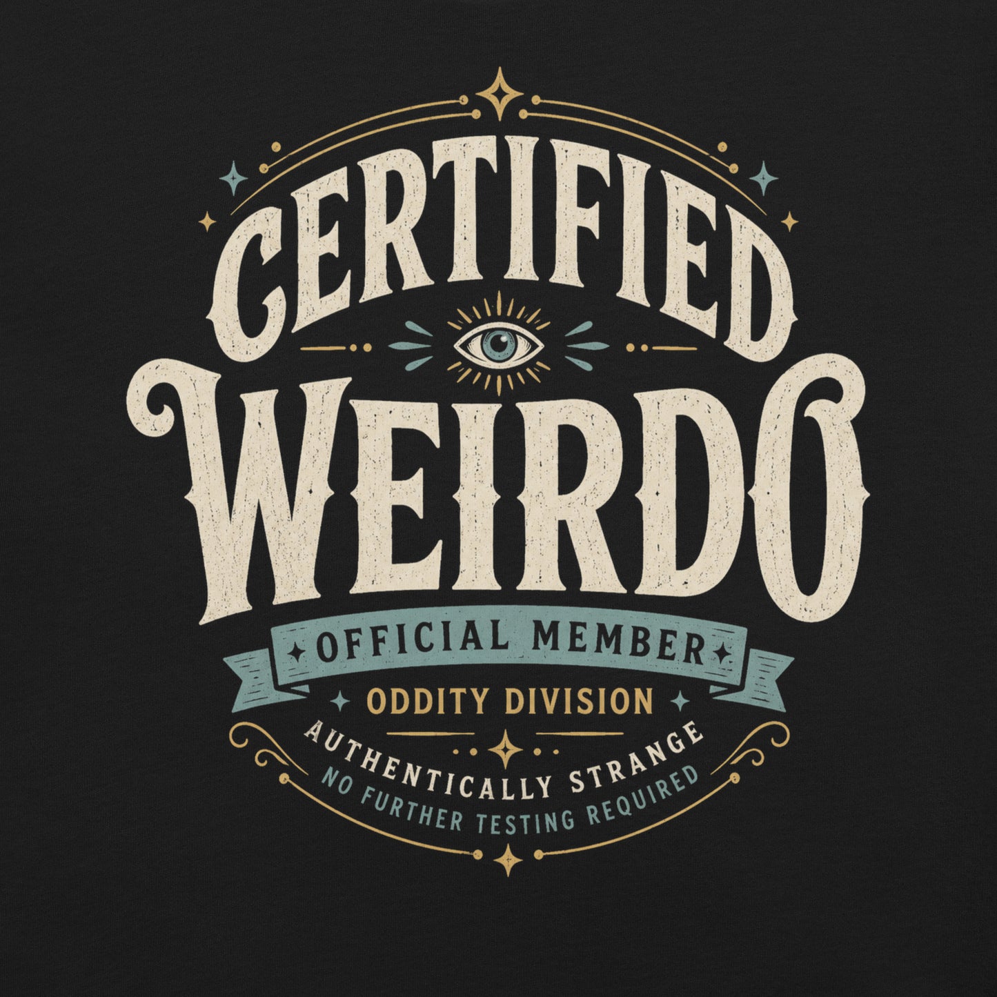 Close-up of the Certified Weirdo original Cinderpoint Studios artwork printed on a black tee, showing distressed retro lettering, all-seeing eye illustration, stars, banner details, and No Further Testing Required text.