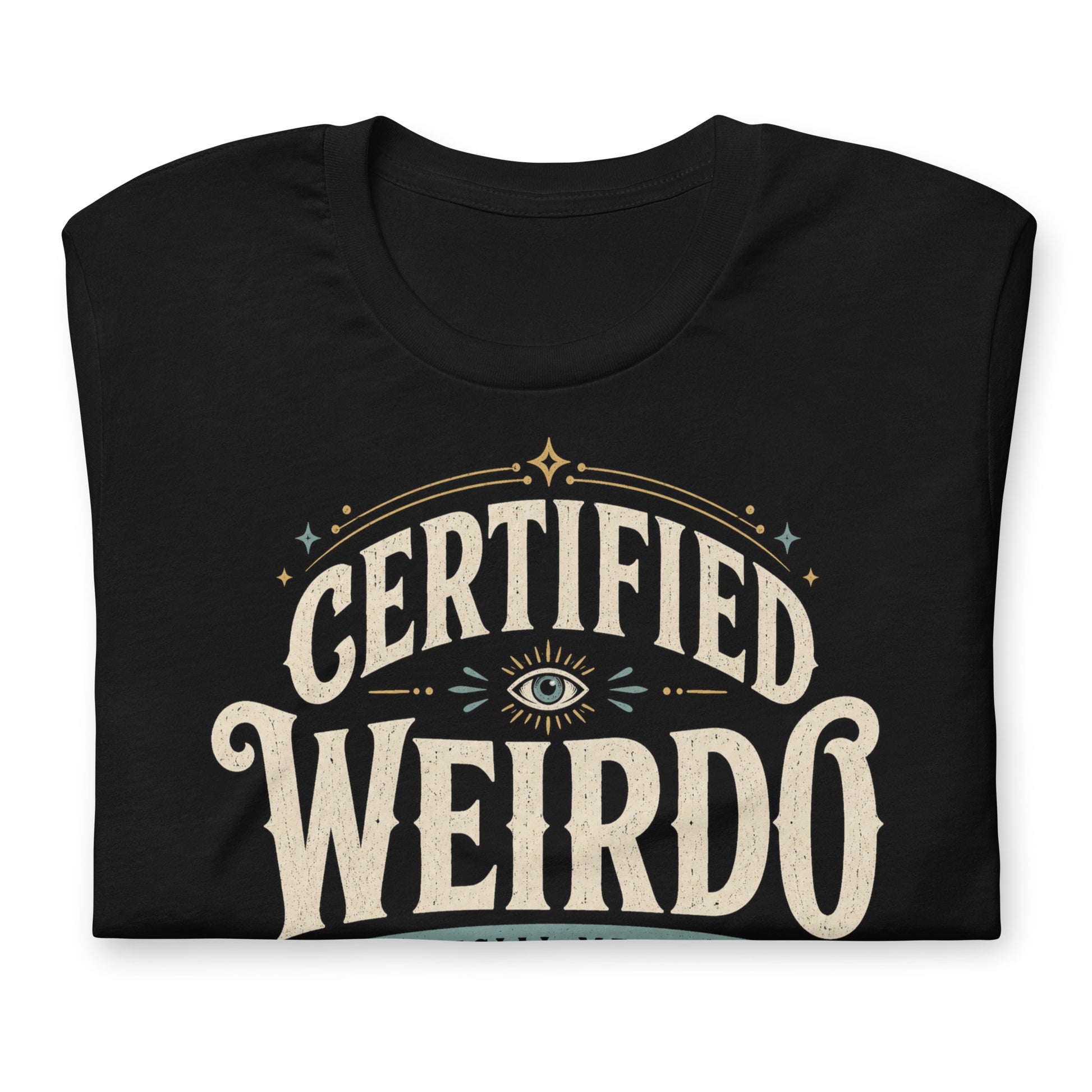 Close-up of the Certified Weirdo original Cinderpoint Studios artwork printed on a black tee, showing distressed retro lettering, all-seeing eye illustration, stars, banner details, and No Further Testing Required text.
