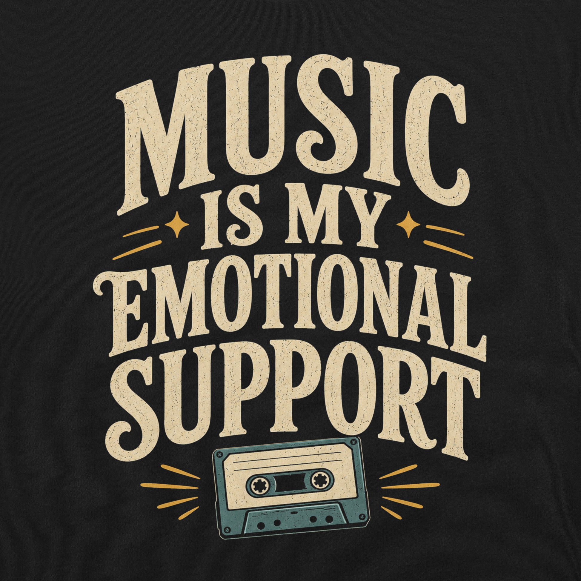 Close up of a graphic tee featuring original Cinderpoint Studios artwork for Music Is My Emotional Support, a retro music lover design with bold vintage lettering, star accents, and a cassette tape illustration.