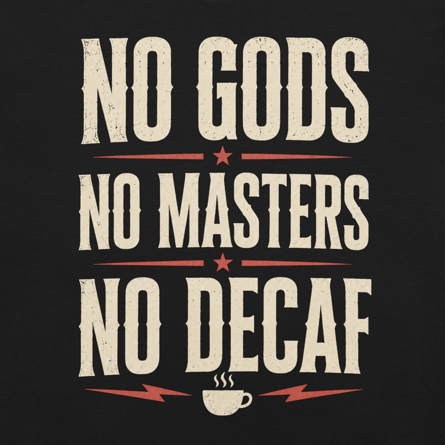 Close up of a black graphic tee featuring original Cinderpoint Studios artwork for No Gods No Masters No Decaf, a bold retro text design with cream lettering, red accent stars, lightning bolts, and a small coffee cup graphic.