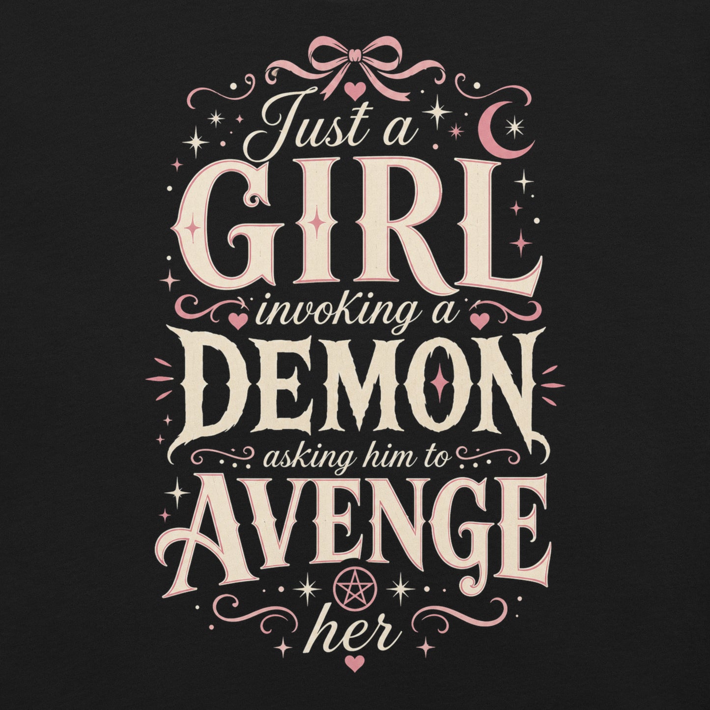 Black graphic tee featuring original Cinderpoint Studios artwork for Just a Girl Invoking a Demon, a feminine occult humor design with bold vintage lettering, pink bow accents, crescent moon, stars, hearts, and a small pentagram.