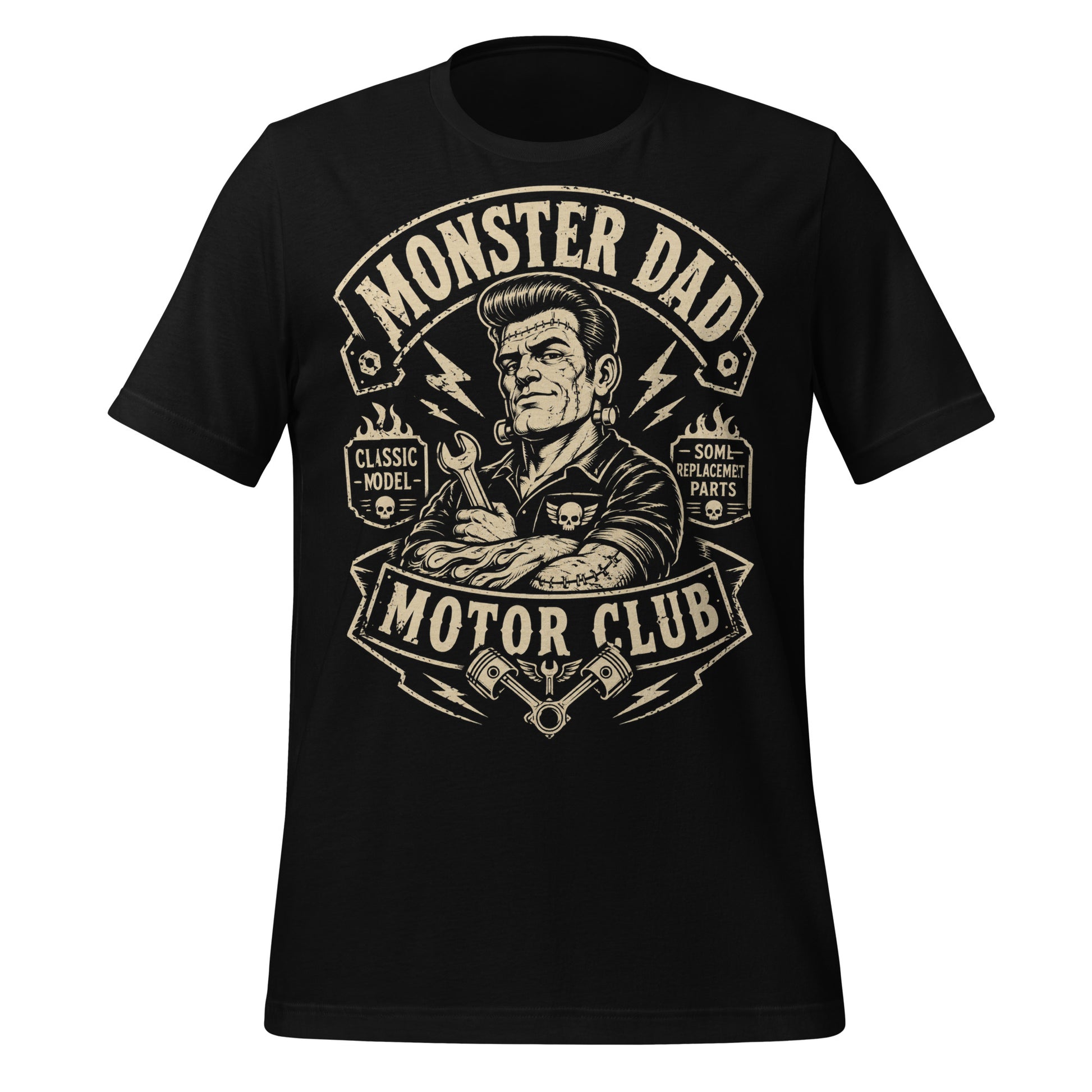 A black graphic tee featuring original Cinderpoint Studios artwork for Monster Dad Motor Club, a one-color retro garage design with a Frankenstein-inspired dad mechanic holding a wrench, lightning bolts, flames, skull details, piston accents, and text including Classic Model and Some Replacement Parts.