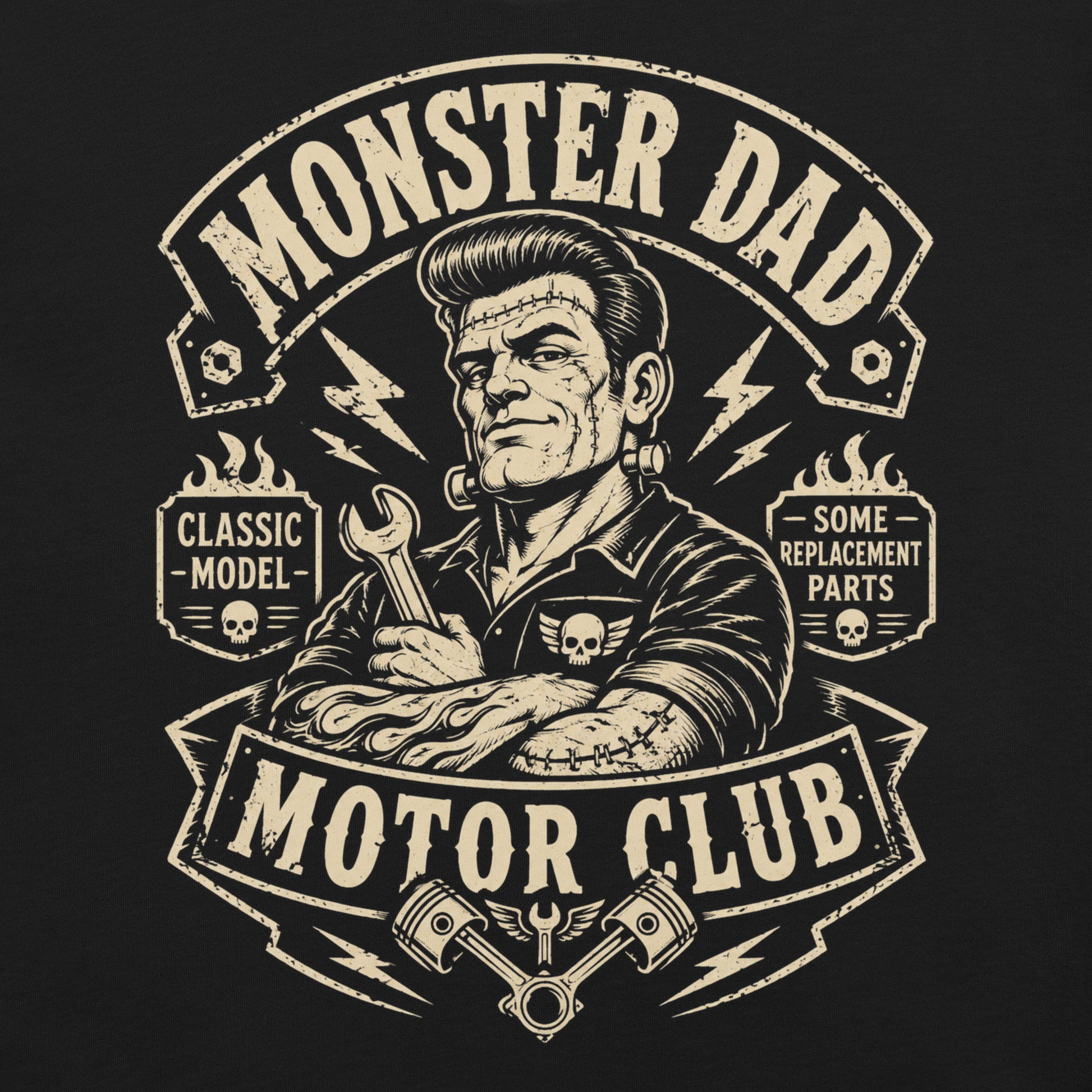 A black graphic tee featuring original Cinderpoint Studios artwork for Monster Dad Motor Club, a one-color retro garage design with a Frankenstein-inspired dad mechanic holding a wrench, lightning bolts, flames, skull details, piston accents, and text including Classic Model and Some Replacement Parts.
