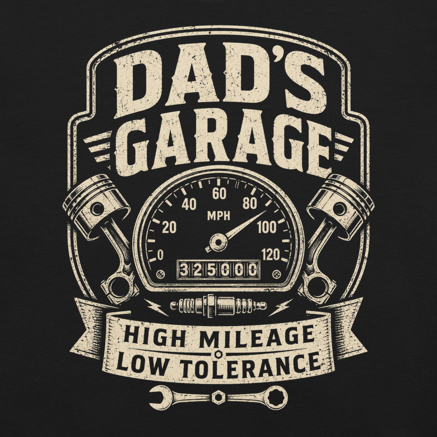 A black graphic tee featuring original Cinderpoint Studios artwork for Dad’s Garage, a one-color retro garage badge design with bold lettering, a speedometer, pistons, spark plug, wrench, and High Mileage Low Tolerance text.