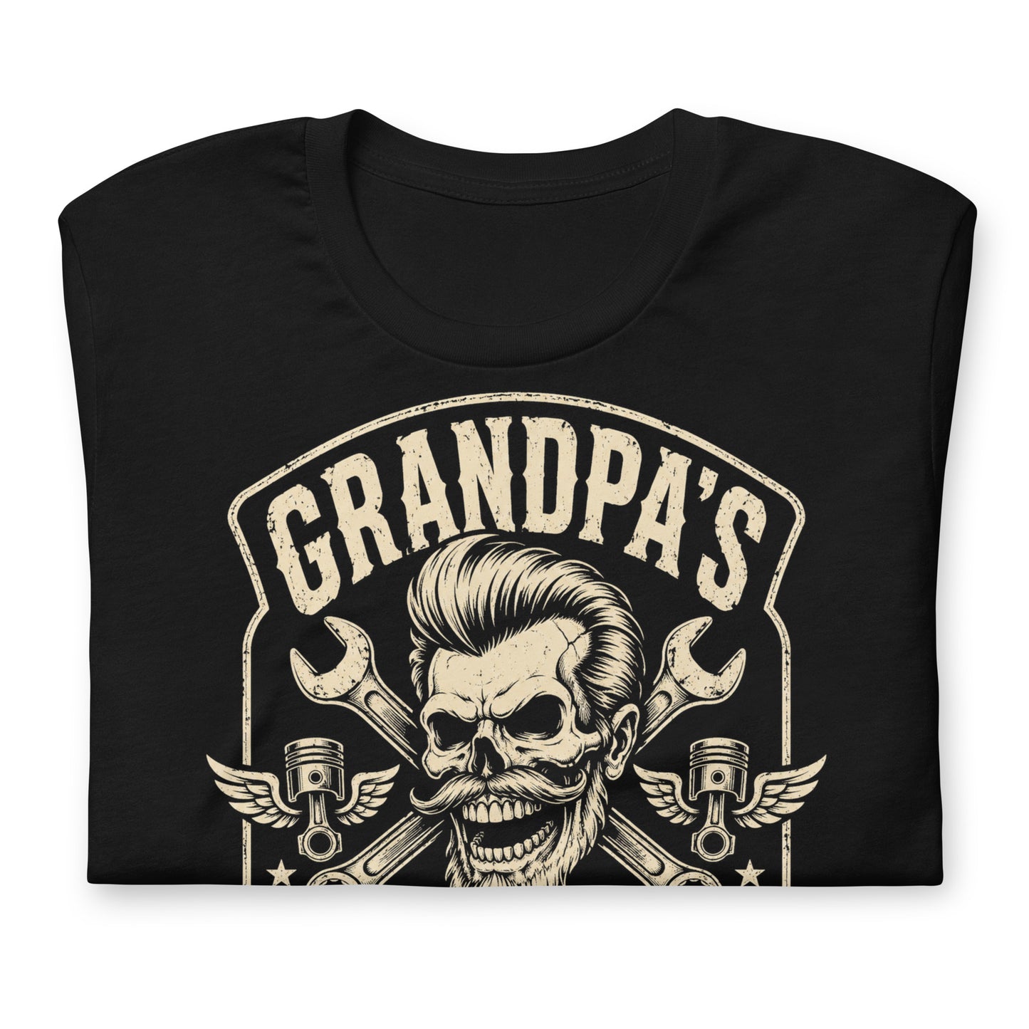 A black graphic tee featuring original Cinderpoint Studios artwork for Grandpa’s Speed Shop, a one-color retro garage design with a grinning skeletal grandpa, pompadour, mustache, crossed wrenches, winged pistons, flame accents, and No Refunds No Mercy text.