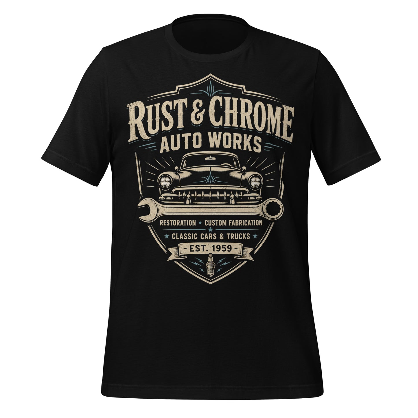 A black graphic tee featuring original Cinderpoint Studios artwork for Rust & Chrome Auto Works, a vintage garage design with a front-facing classic car, bold lettering, wrench accent, spark plug detail, restoration and custom fabrication text, and shield-style framing.