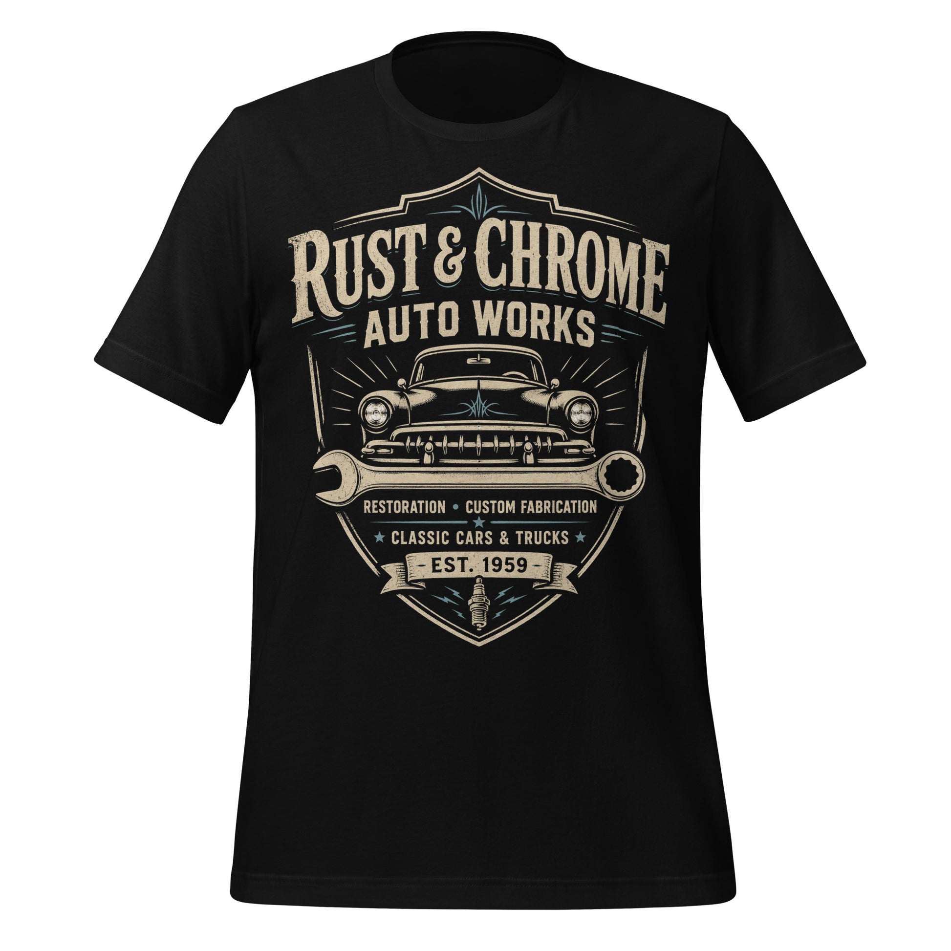A black graphic tee featuring original Cinderpoint Studios artwork for Rust & Chrome Auto Works, a vintage garage design with a front-facing classic car, bold lettering, wrench accent, spark plug detail, restoration and custom fabrication text, and shield-style framing.