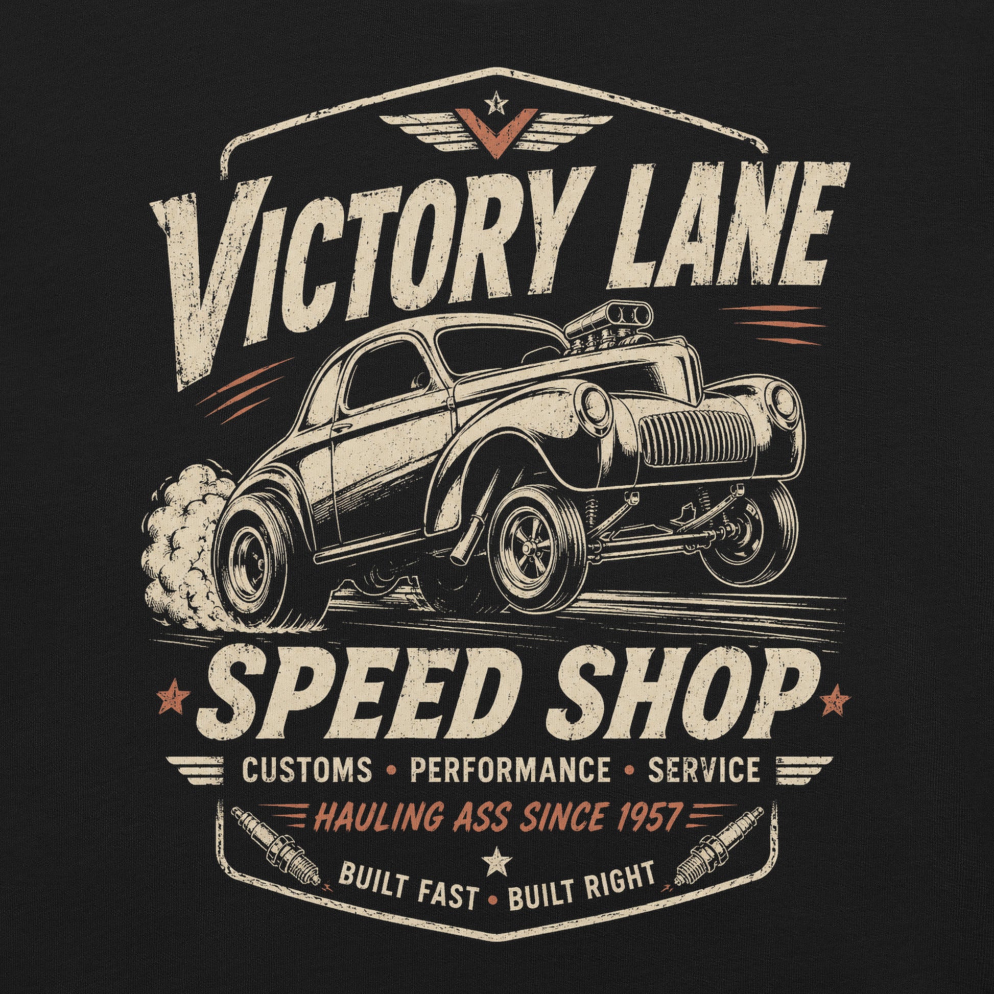 Black graphic tee featuring original Cinderpoint Studios artwork for Victory Lane Speed Shop, a retro hot rod design with a gasser-style car launching hard, bold vintage lettering, spark plug accents, orange speed details, and Built Fast Built Right text.