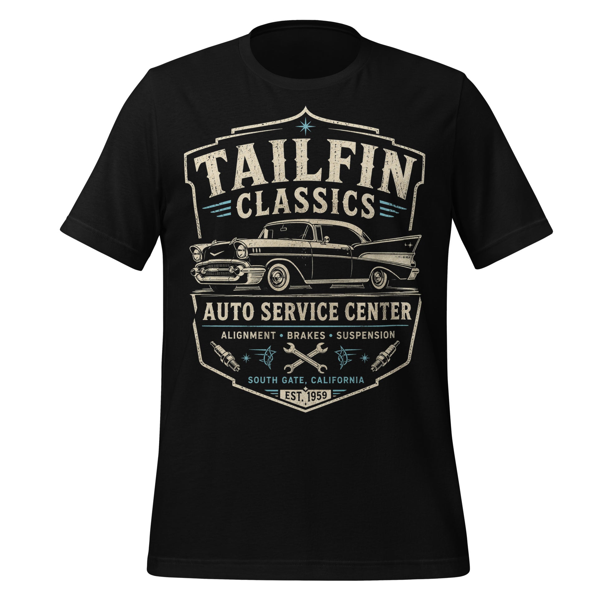 Black graphic tee featuring original Cinderpoint Studios artwork for Tailfin Classics, a retro auto service center design with a 1950s-style classic car, bold tailfins, vintage lettering, teal accents, crossed wrenches, spark plugs, and Alignment Brakes Suspension text.
