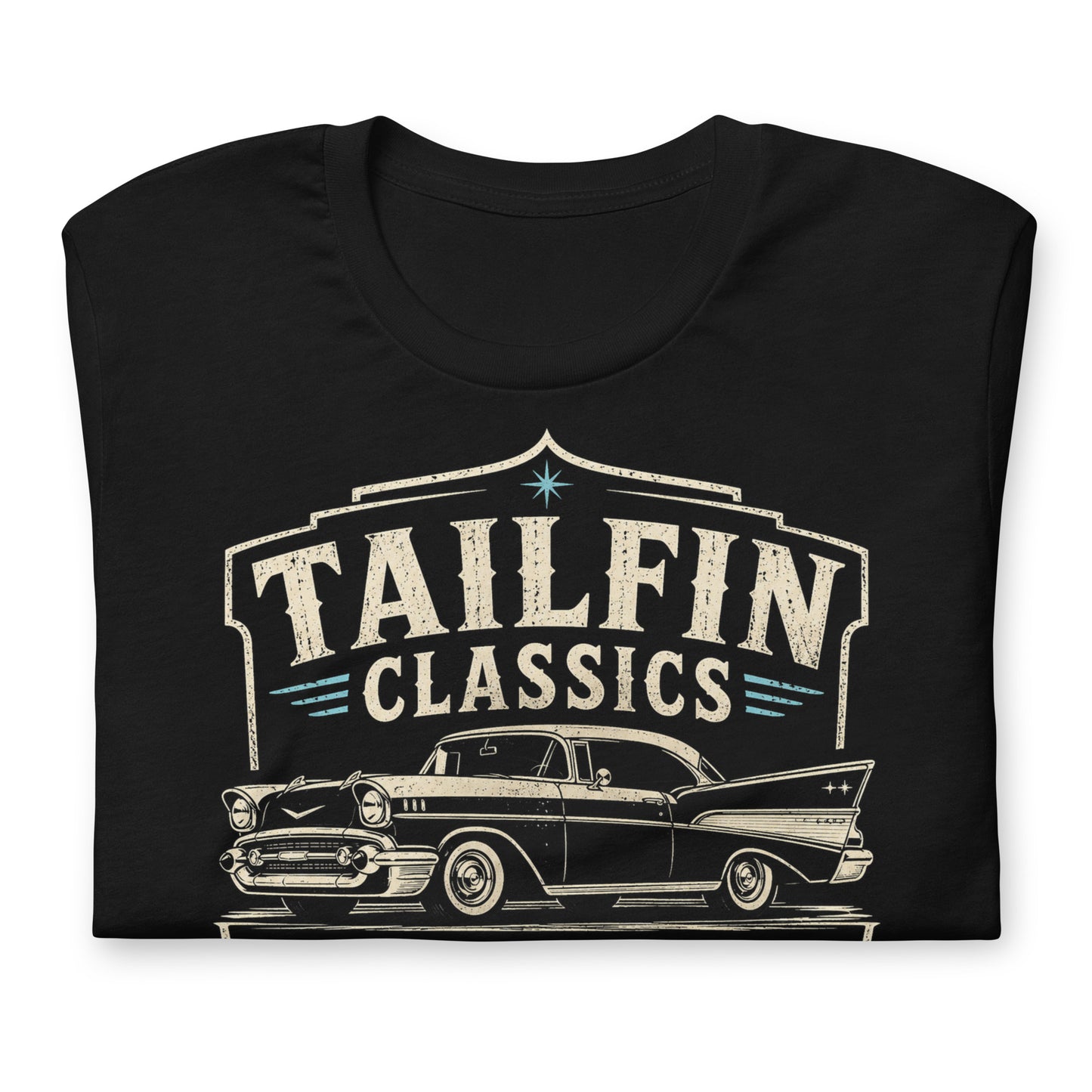 Black graphic tee featuring original Cinderpoint Studios artwork for Tailfin Classics, a retro auto service center design with a 1950s-style classic car, bold tailfins, vintage lettering, teal accents, crossed wrenches, spark plugs, and Alignment Brakes Suspension text.