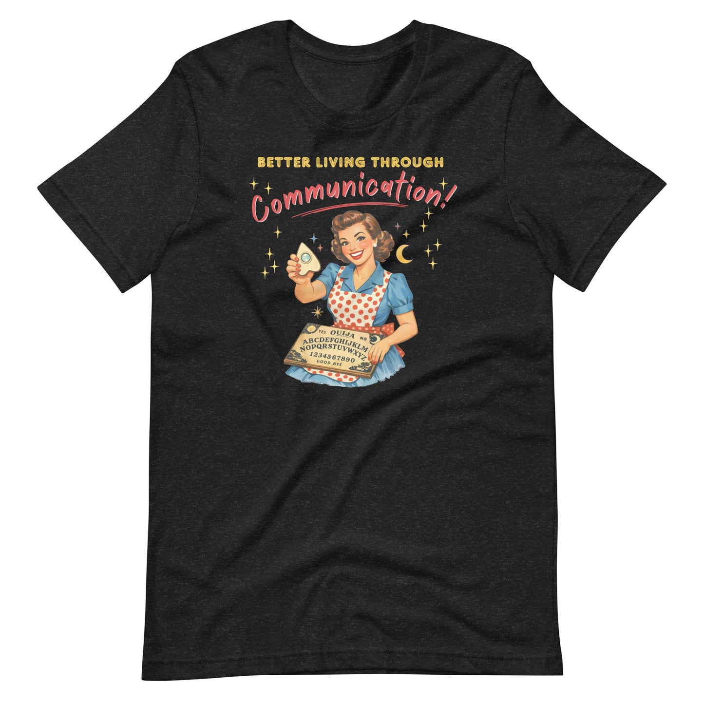 Better Living Through Communication unisex tee — vintage 1950s retro housewife in polka dot apron holding ouija board and planchette with gold stars, gold and red typography on black Bella Canvas 3001 by Cinderpoint Studios