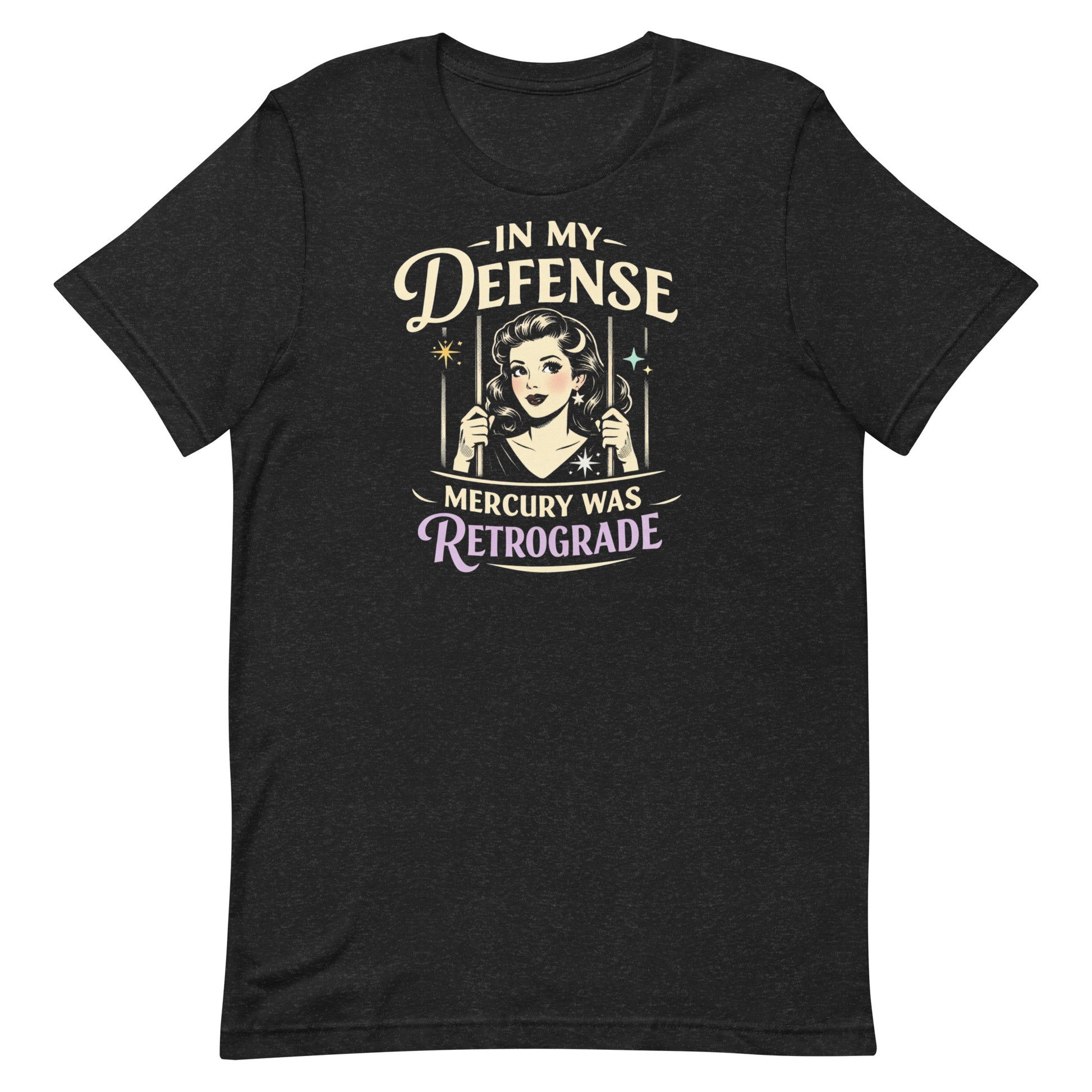 Heathered Black retro graphic t-shirt featuring a vintage-inspired woman behind bars with the phrase In My Defense Mercury Was Retrograde in cream and lavender lettering.