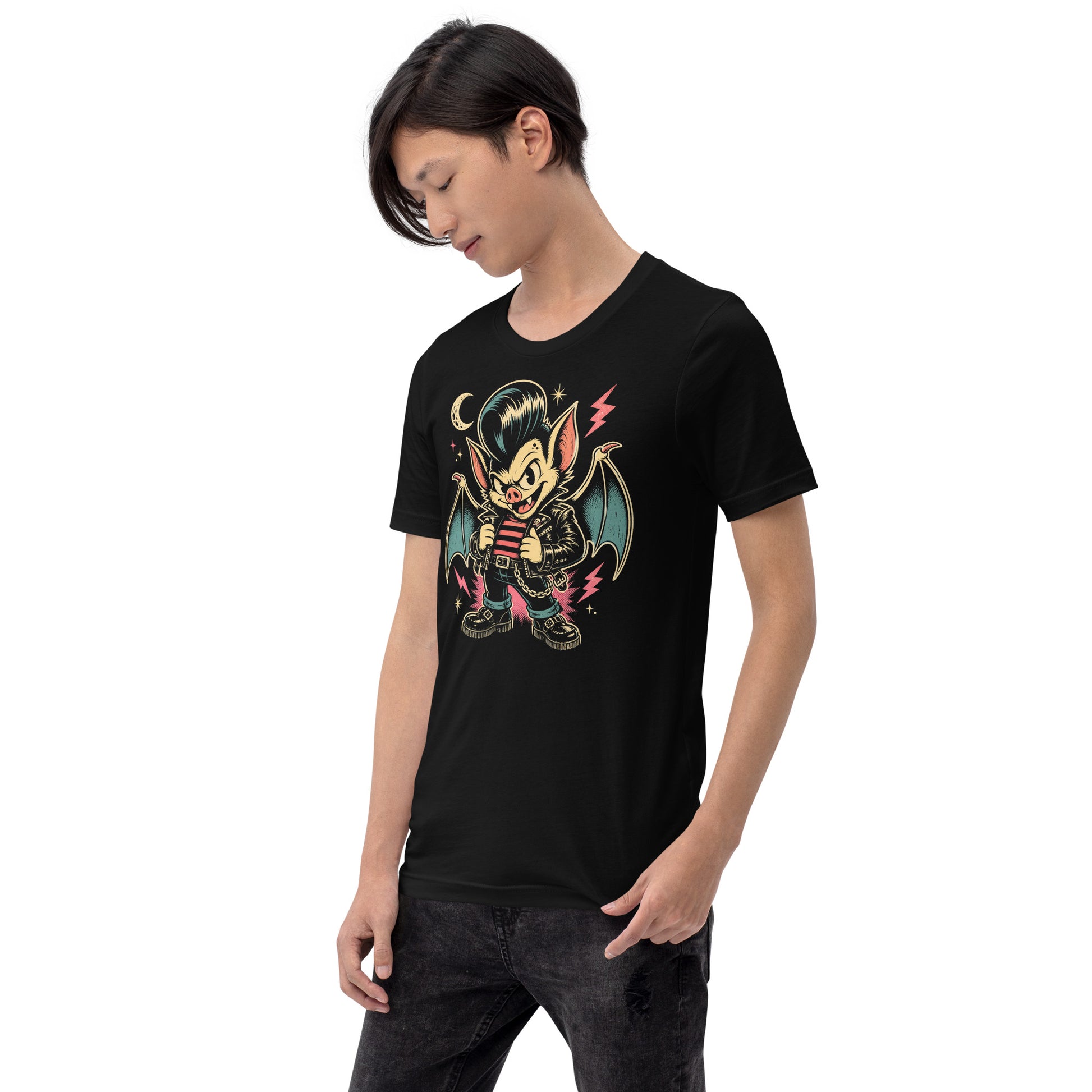 A cartoon-style vampire bat greaser with a pompadour, wearing a leather jacket and striped shirt, standing in a defiant pose with lightning bolts and a crescent moon on our premium black tee.