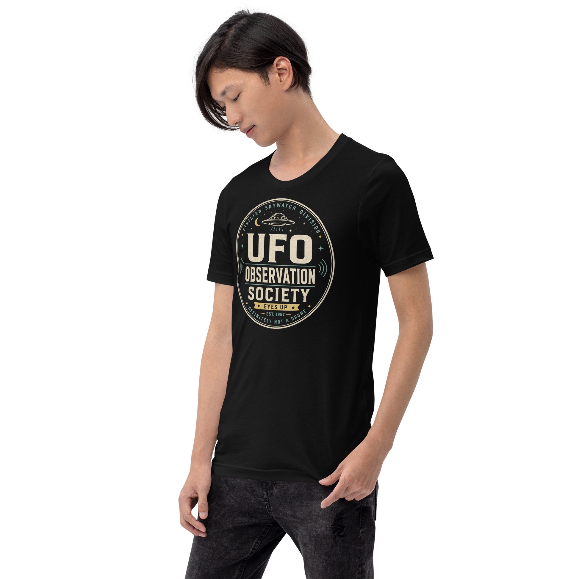 Male lifestyle mockup wearing black UFO Observation Society t-shirt with retro alien skywatch graphic by Cinderpoint Studios