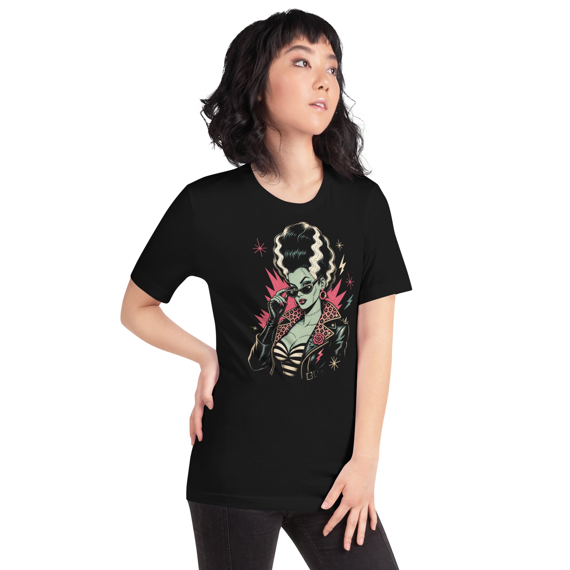 Artistic illustration of a green-skinned monster bride with high-volume black and white hair, cat-eye sunglasses, and a leopard-print lined leather jacket on a black t-shirt.