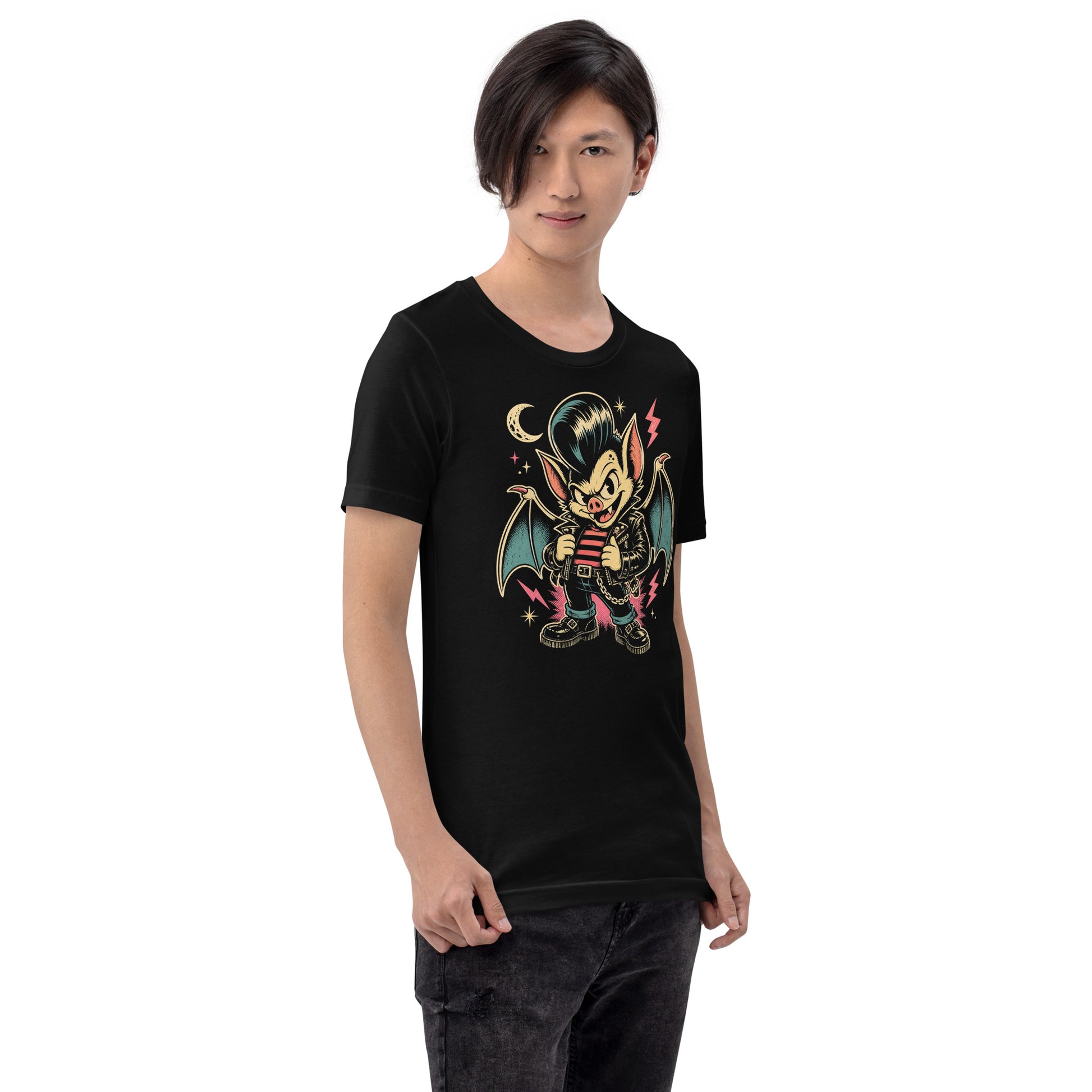A cartoon-style vampire bat greaser with a pompadour, wearing a leather jacket and striped shirt, standing in a defiant pose with lightning bolts and a crescent moon on our premium black tee.