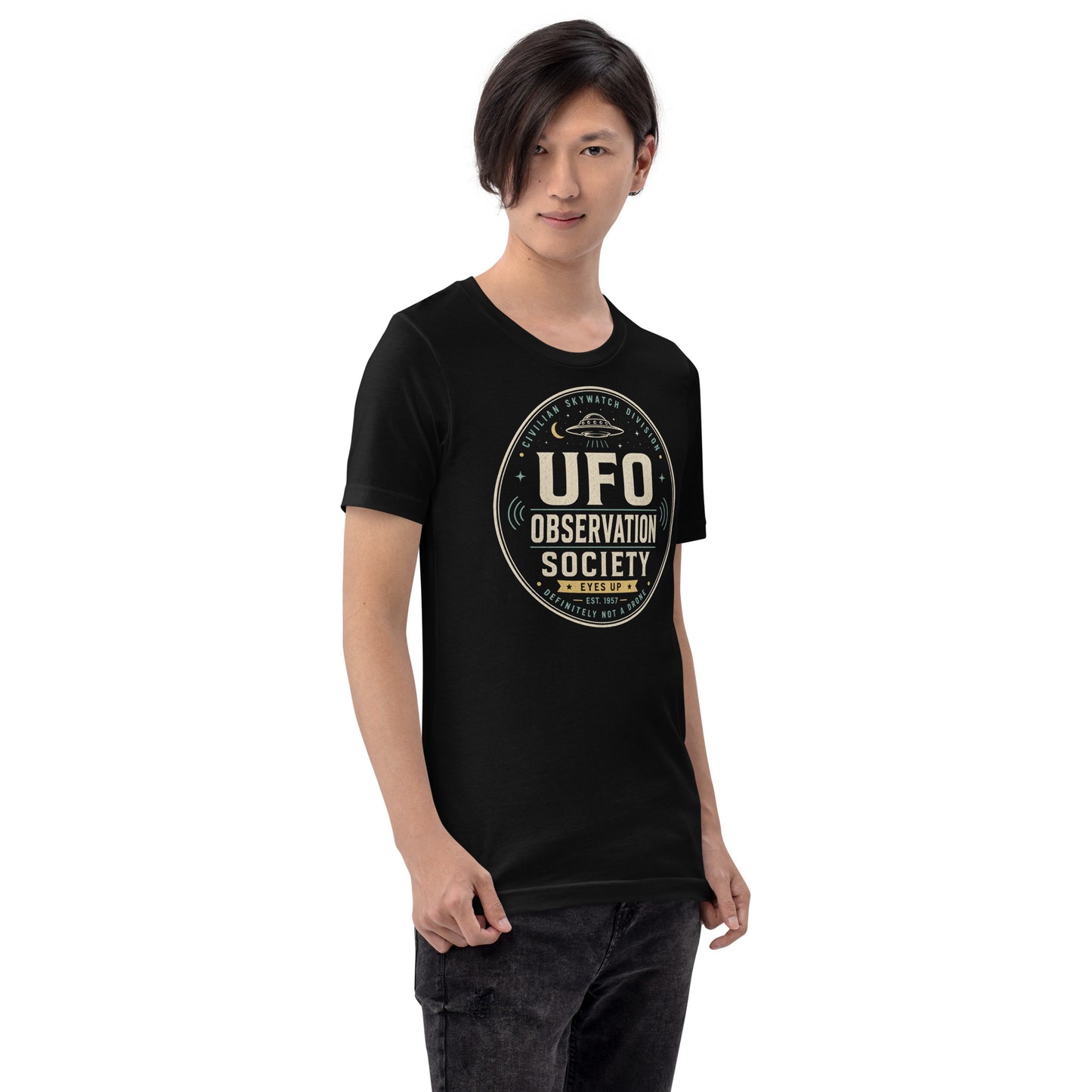 Male lifestyle mockup wearing black UFO Observation Society t-shirt with retro alien skywatch graphic by Cinderpoint Studios