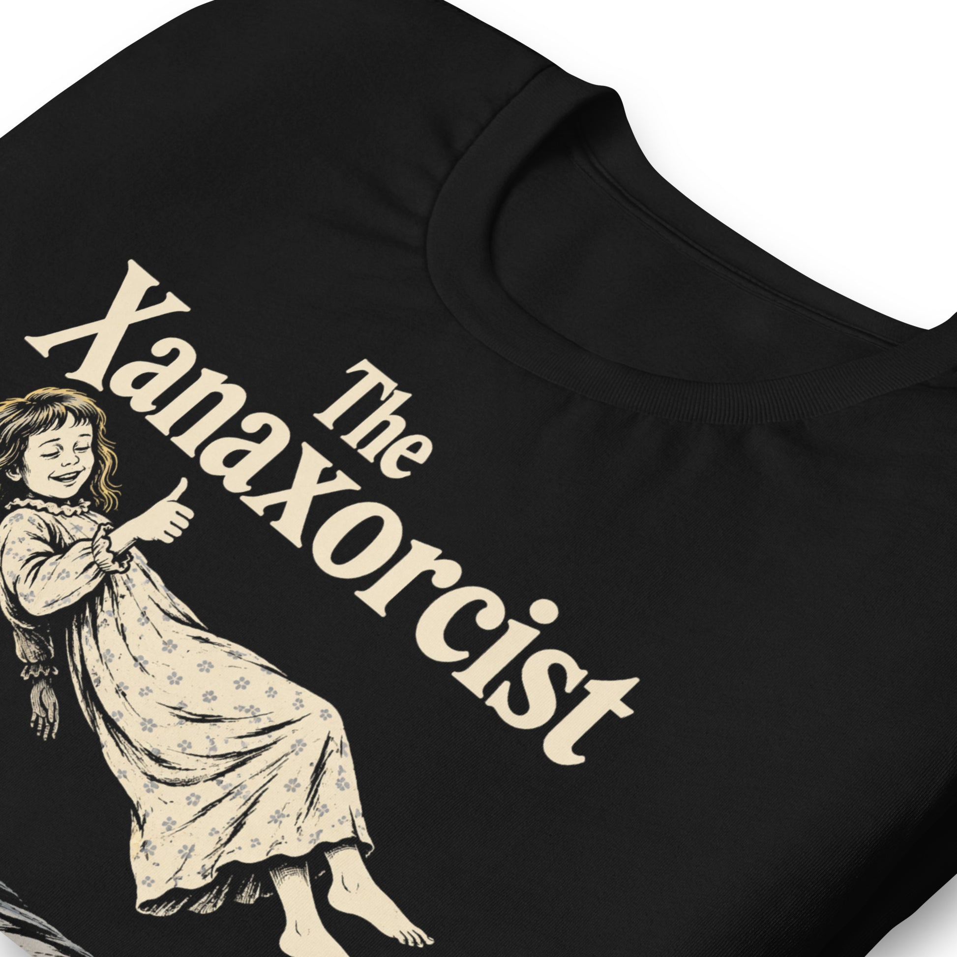 A retro horror-style graphic t-shirt featuring "The Xanaxorcist" in classic cinematic lettering with a stylized, eerie parody of the iconic exorcism scene.