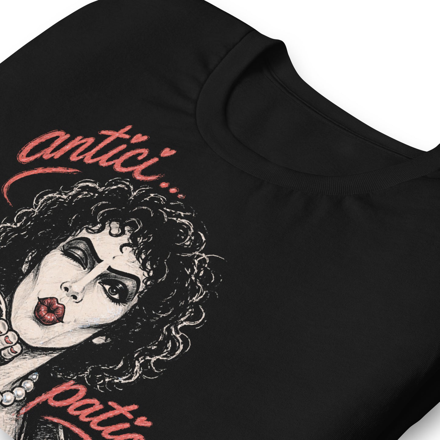 A gritty, high-contrast artistic portrait of Frank N. Furter on a black t-shirt, featuring his iconic curls and makeup with the word "ANTICIPATION" in distressed lipstick lettering.