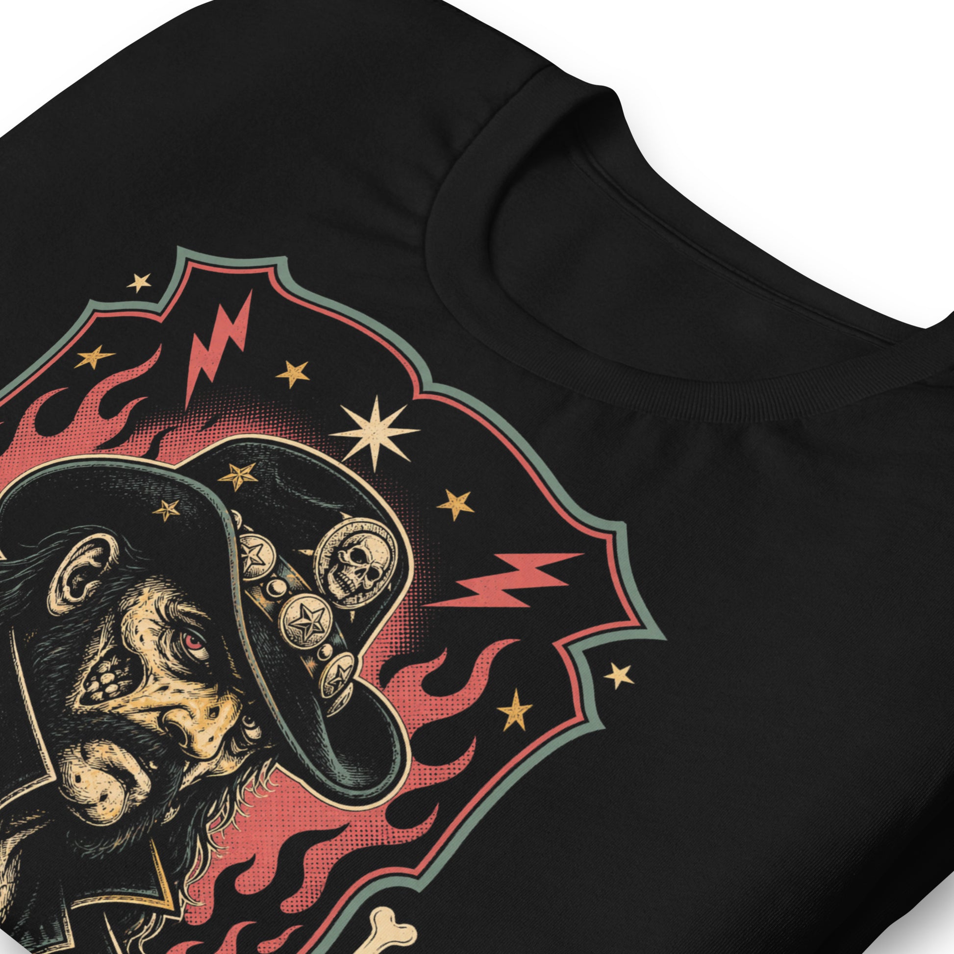 Graphic t-shirt design featuring a lowbrow undead version of Lemmy in a military-style hat with skulls and stars, framed by red flames and lightning bolts on a black background.