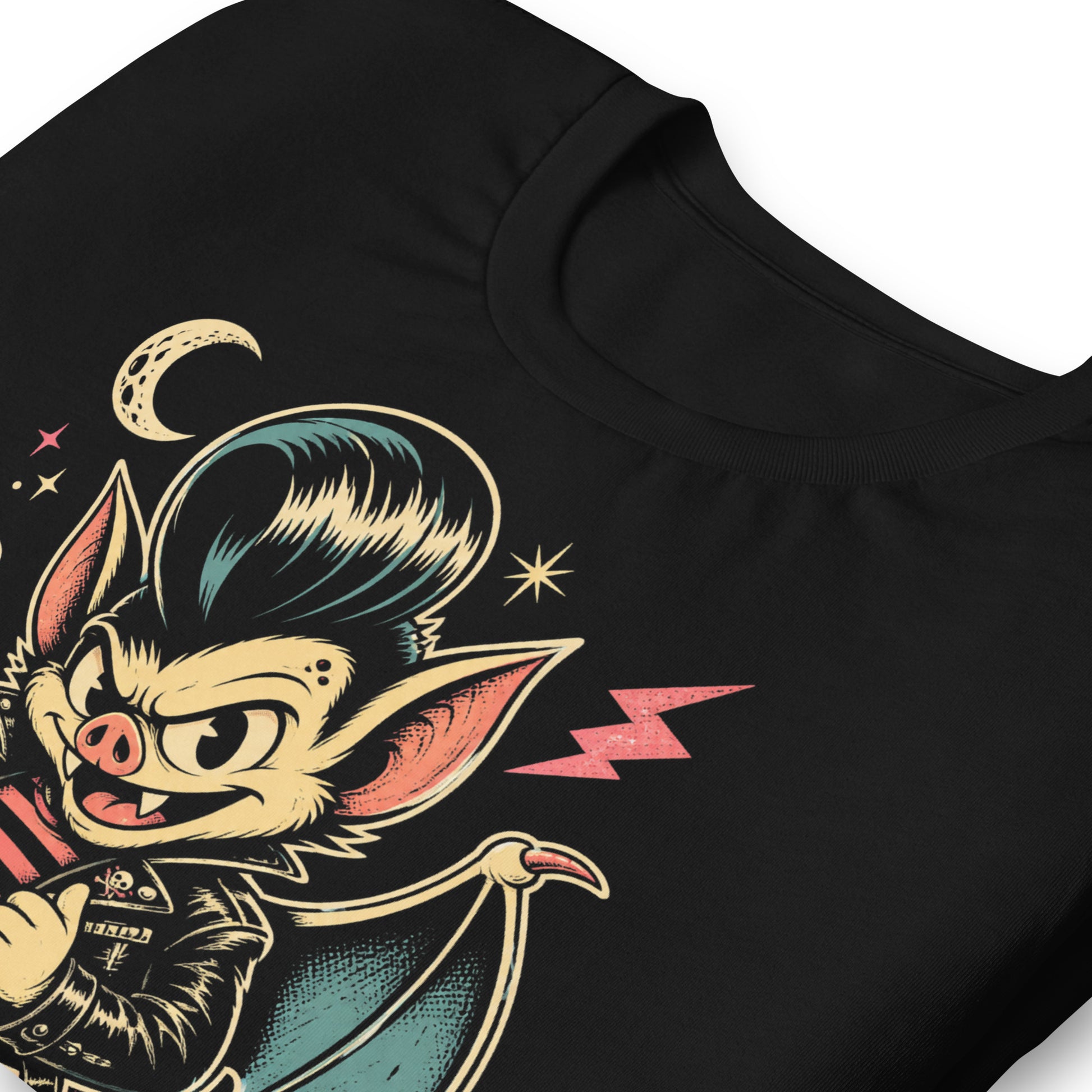A cartoon-style vampire bat greaser with a pompadour, wearing a leather jacket and striped shirt, standing in a defiant pose with lightning bolts and a crescent moon on our premium black tee.